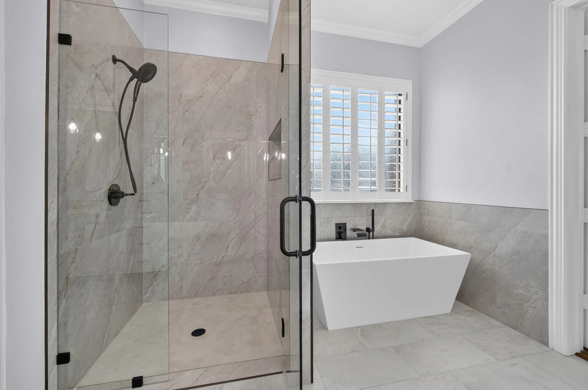 Recently renovated primary free standing shower and tub