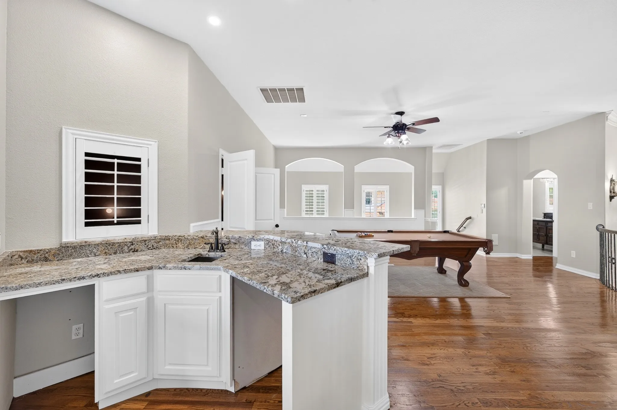 Large wet bar space located in the game room off the media room space