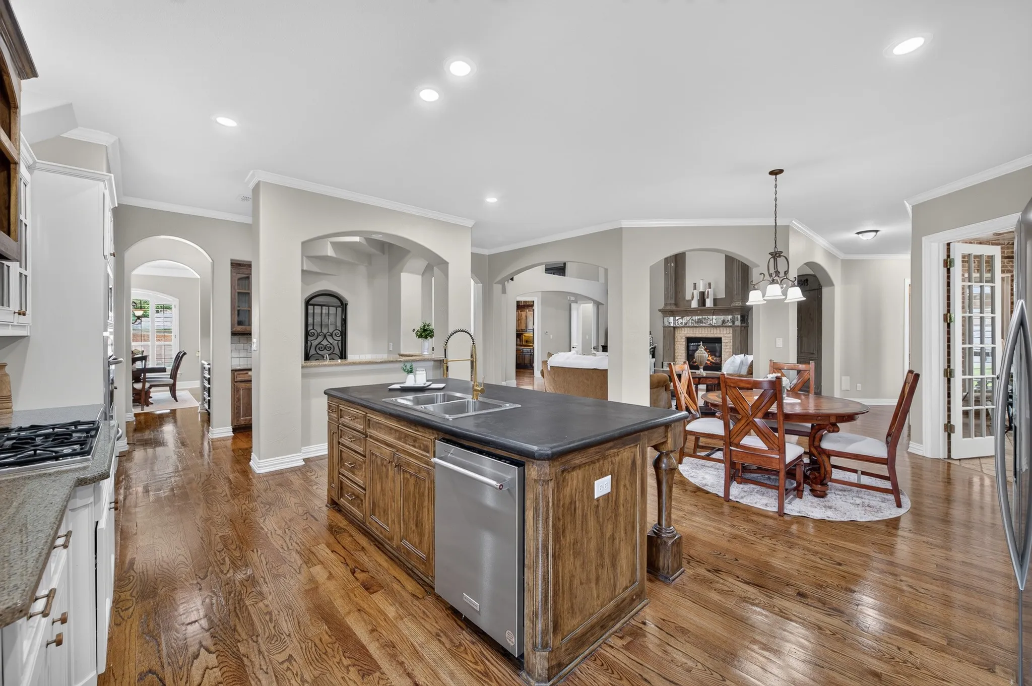 Kitchen looking to the separate breakfast area and open to the family room