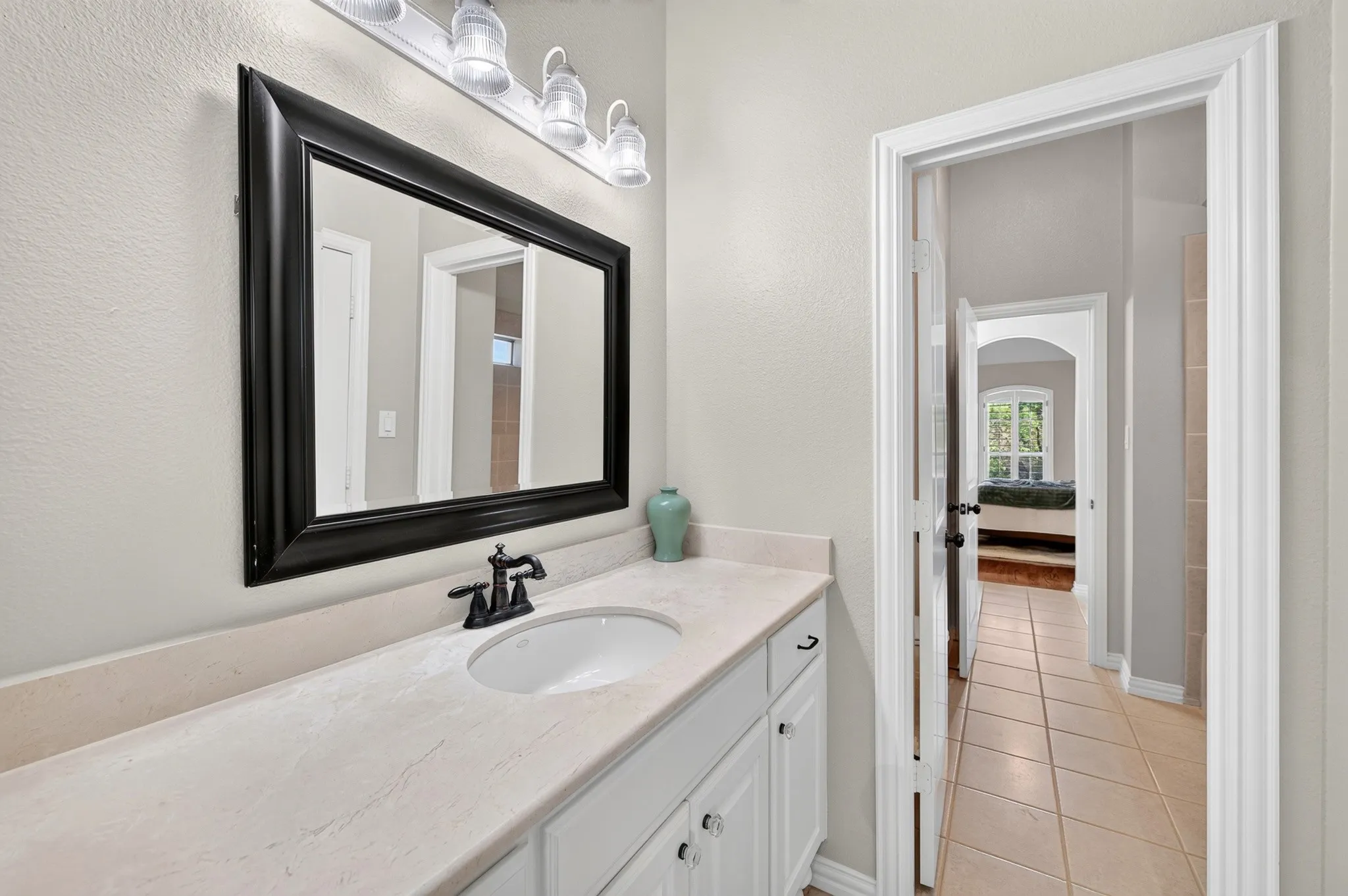 Jack and Jill bathroom located upstairs .  Each room has its own sink space!