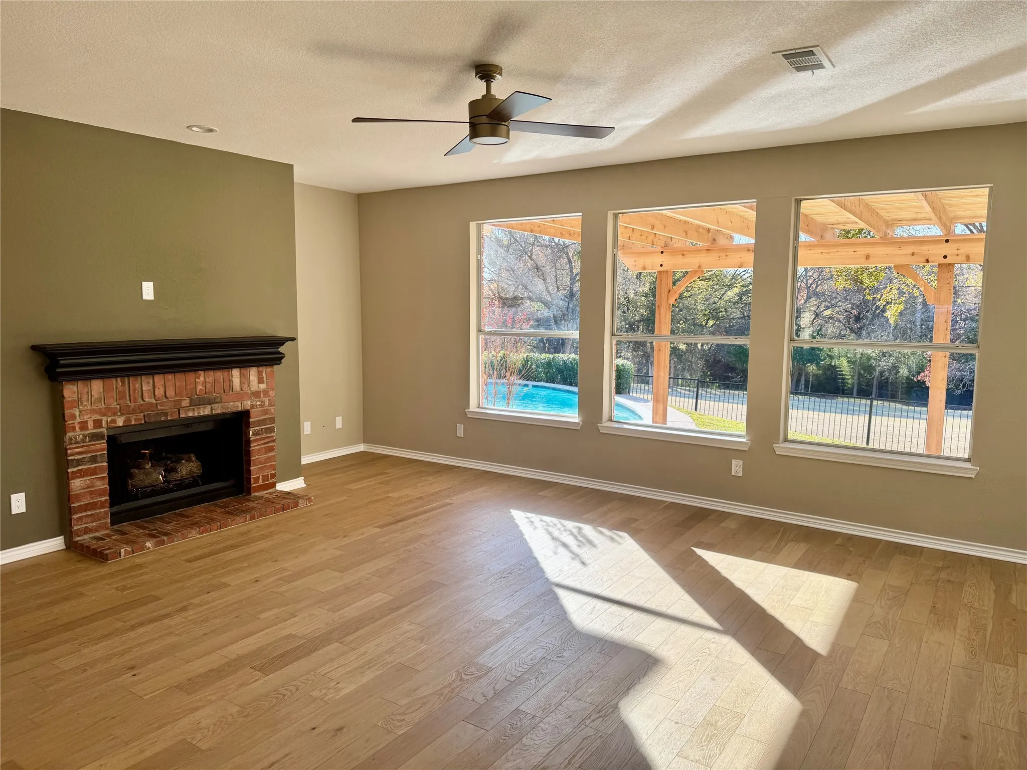 THe Family room has a fireplace for cool evenings.  Summer will be spent in the pool just outside the window.