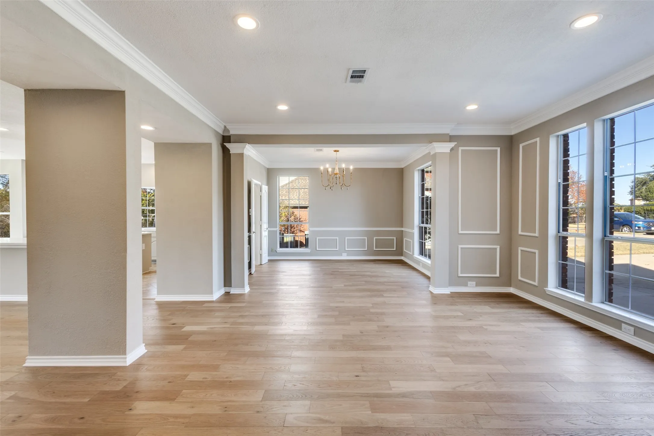 Living room and Dining room.  Notice the new flooring!