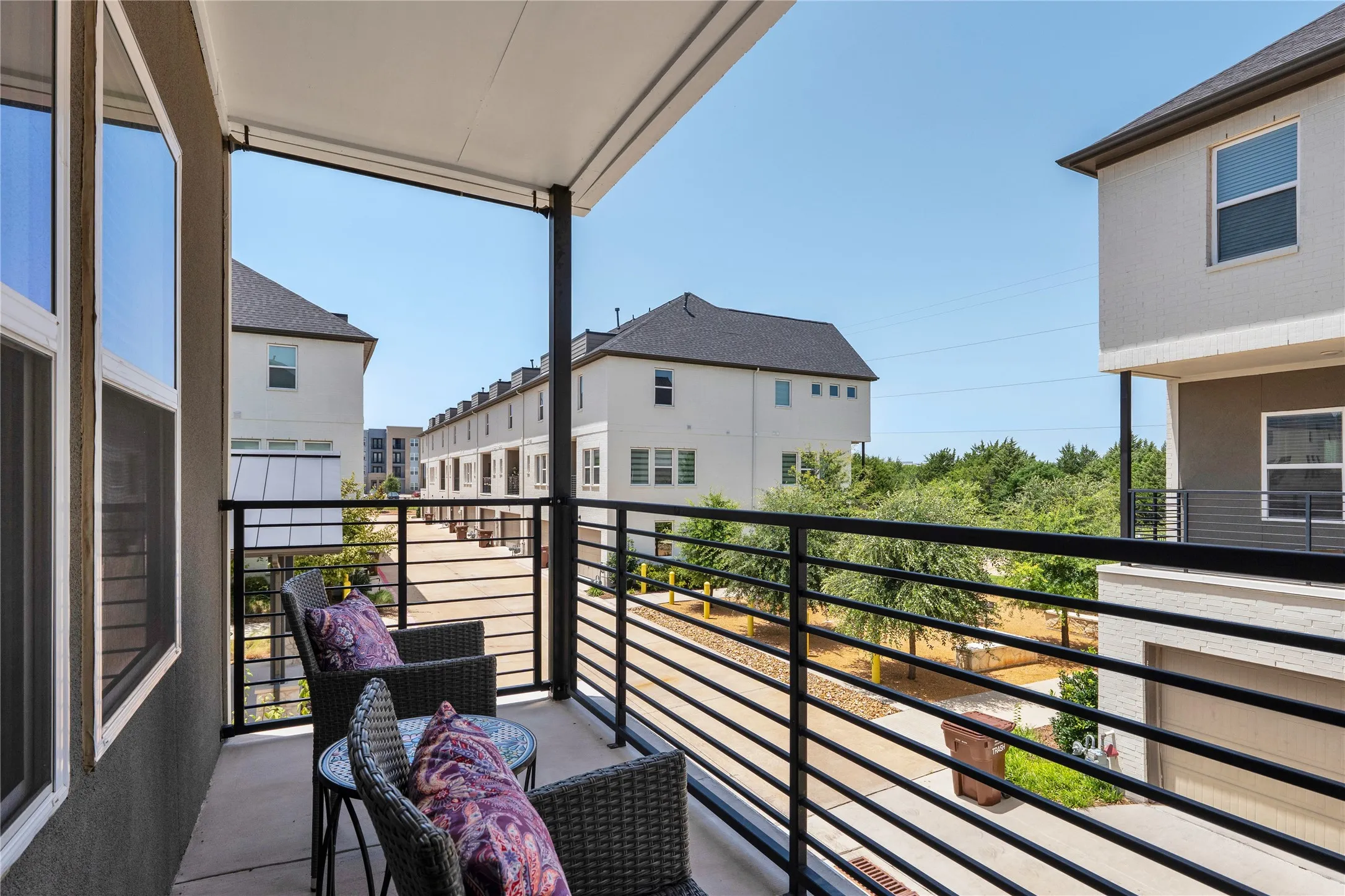 Large Balcony with views of the greenbelt and alley