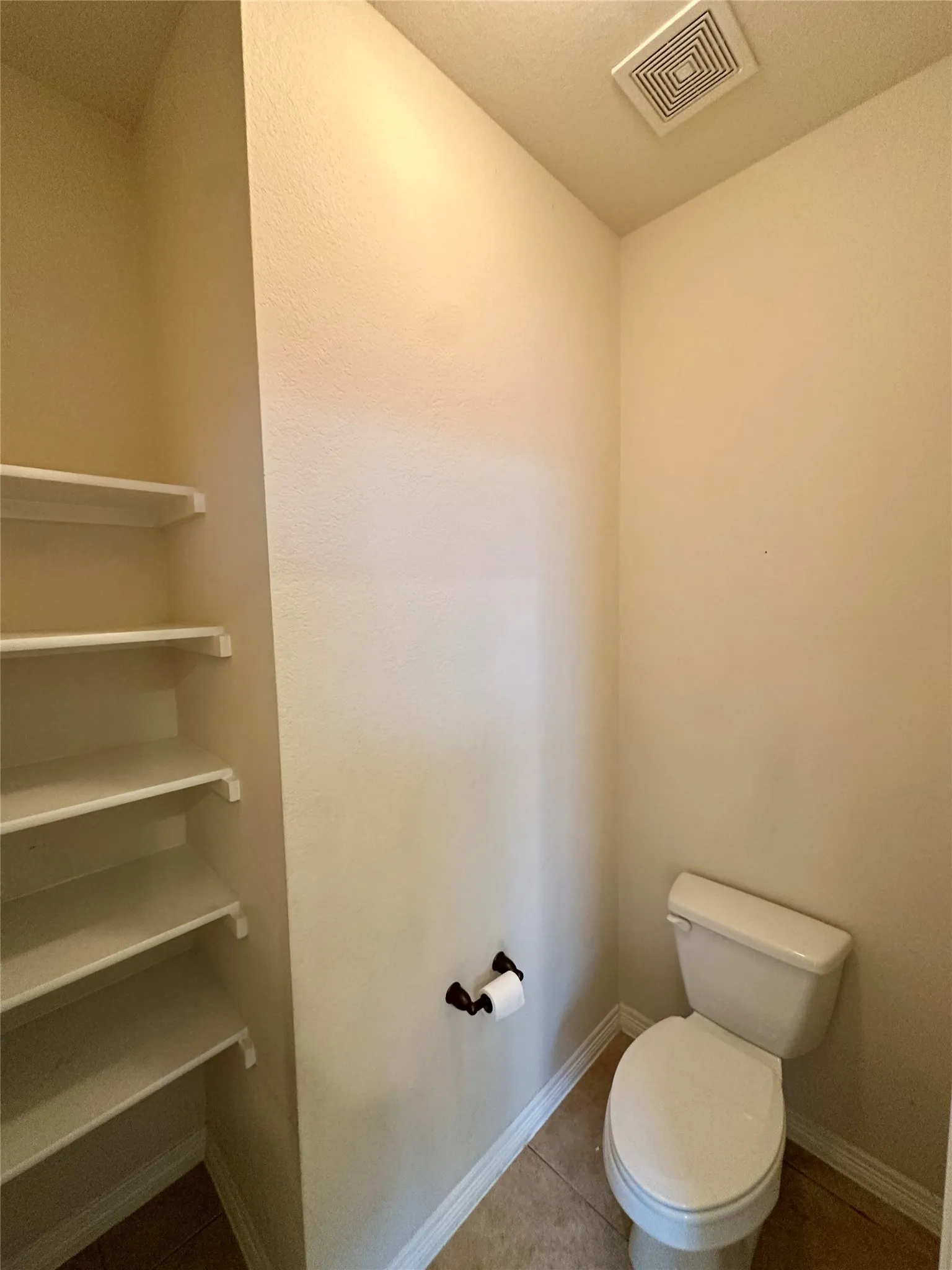 Private toilet area in primary bath