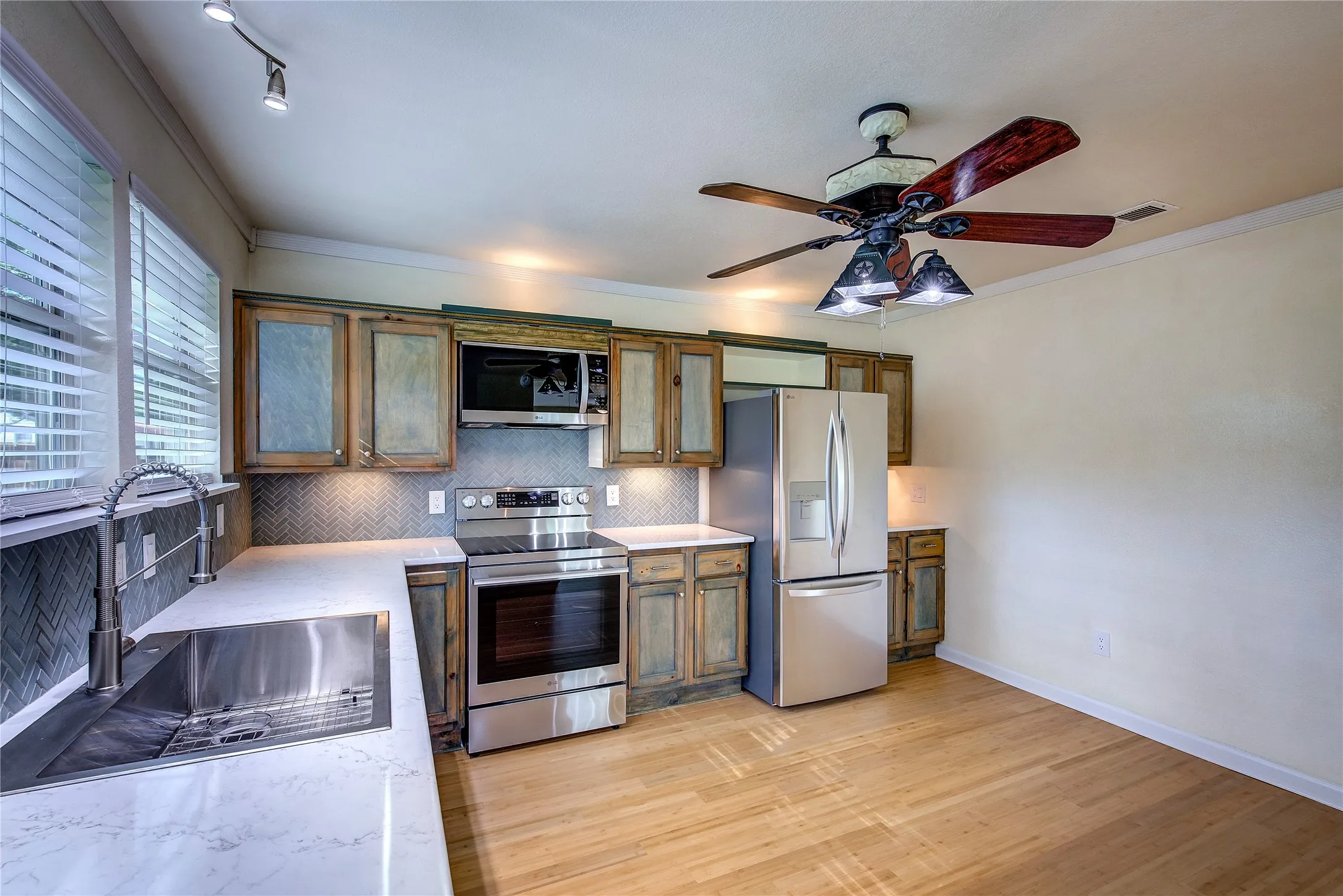Stainless steel farm sink and built-in appliances that are brand new.