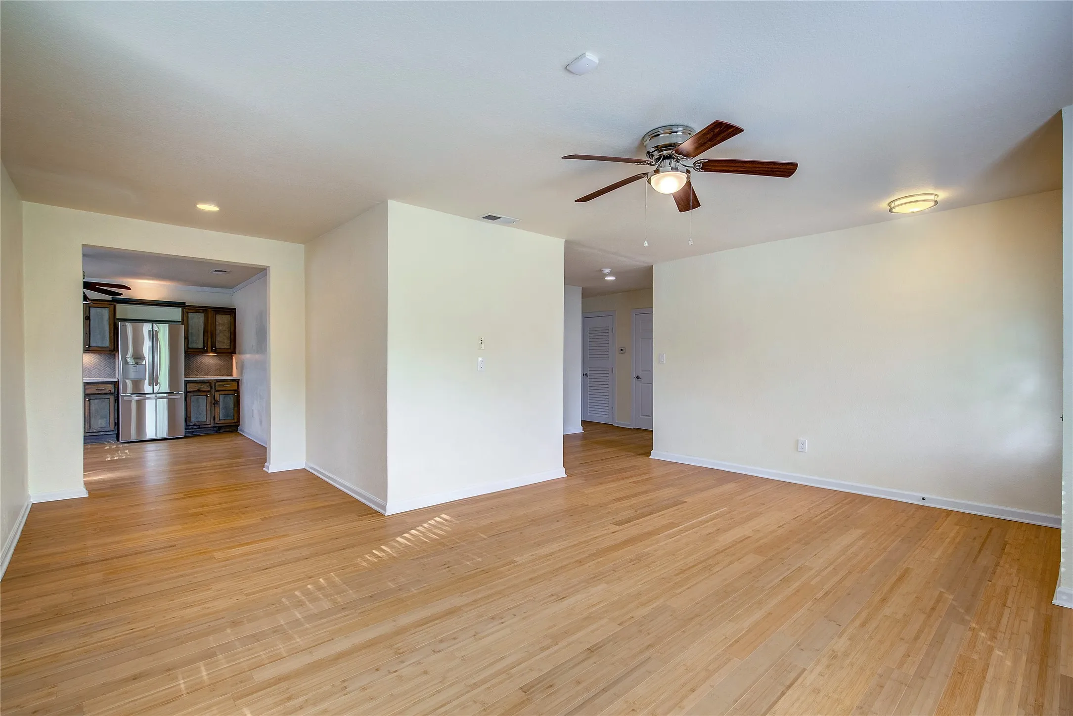 Looking toward the kitchen and nook area with hall access to the bedrooms in view.