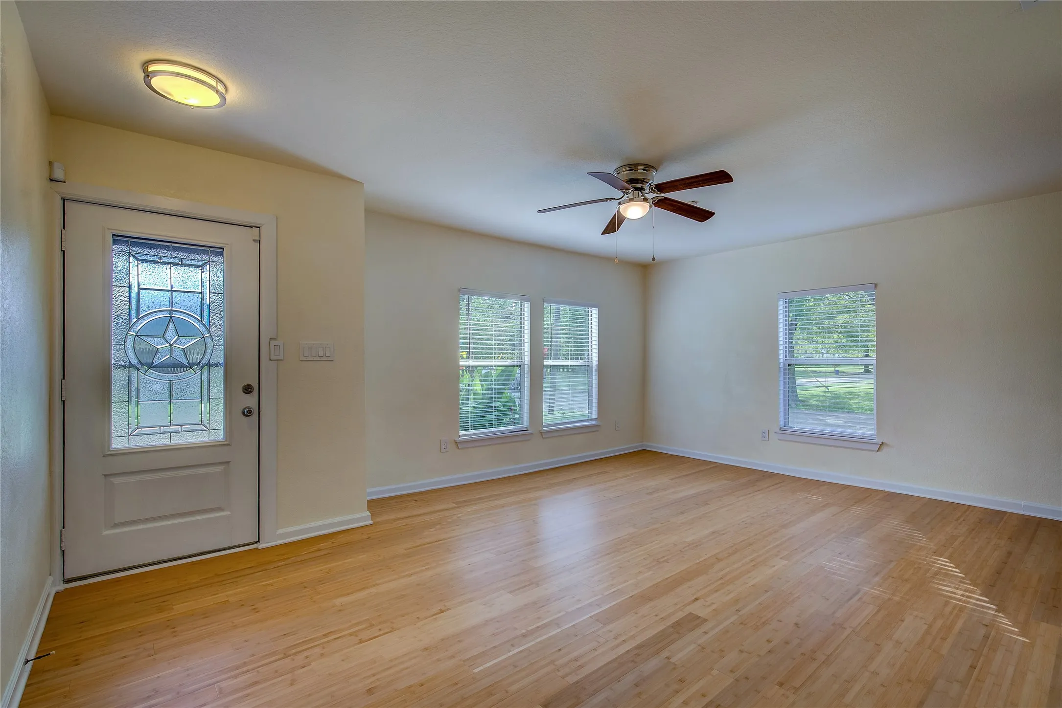 A new door greets you as you enter the living area, complete with new bamboo flooring, Pella windows and blinds.