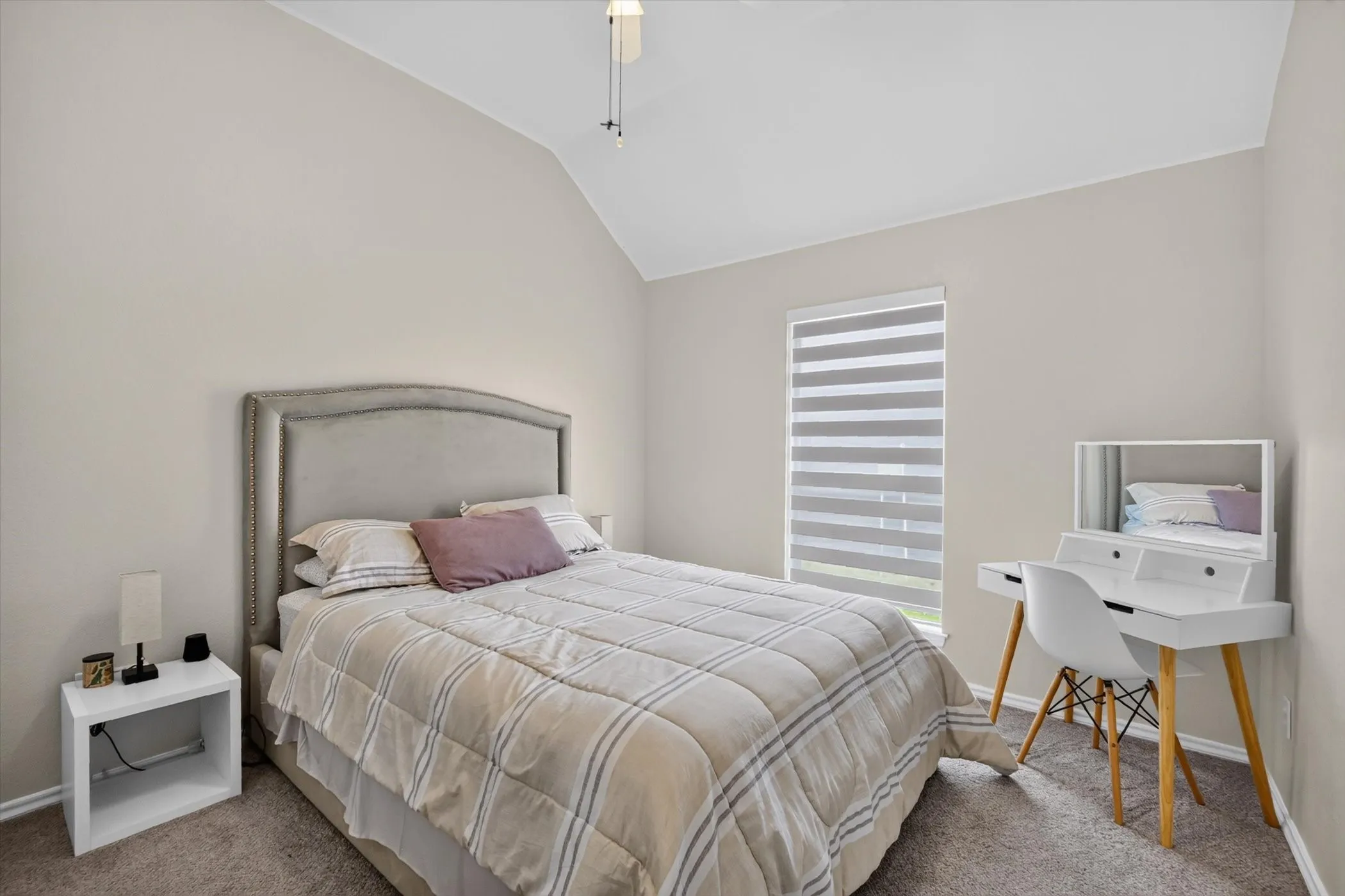 Vaulted ceiling with an overhead light fixture