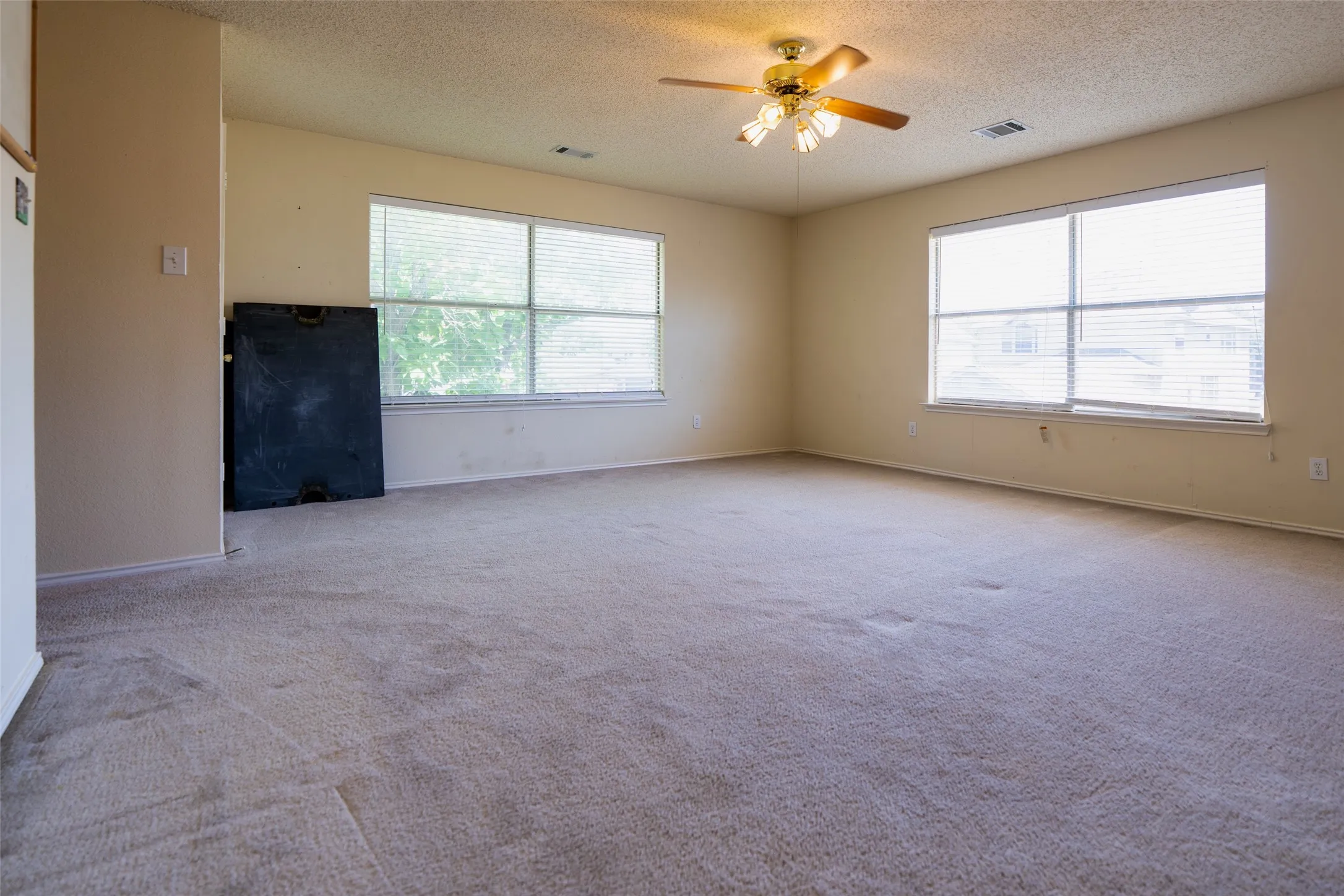 Oversized game room with abundant space for entertaining. Pool table (currently disassembled) will convey with the home