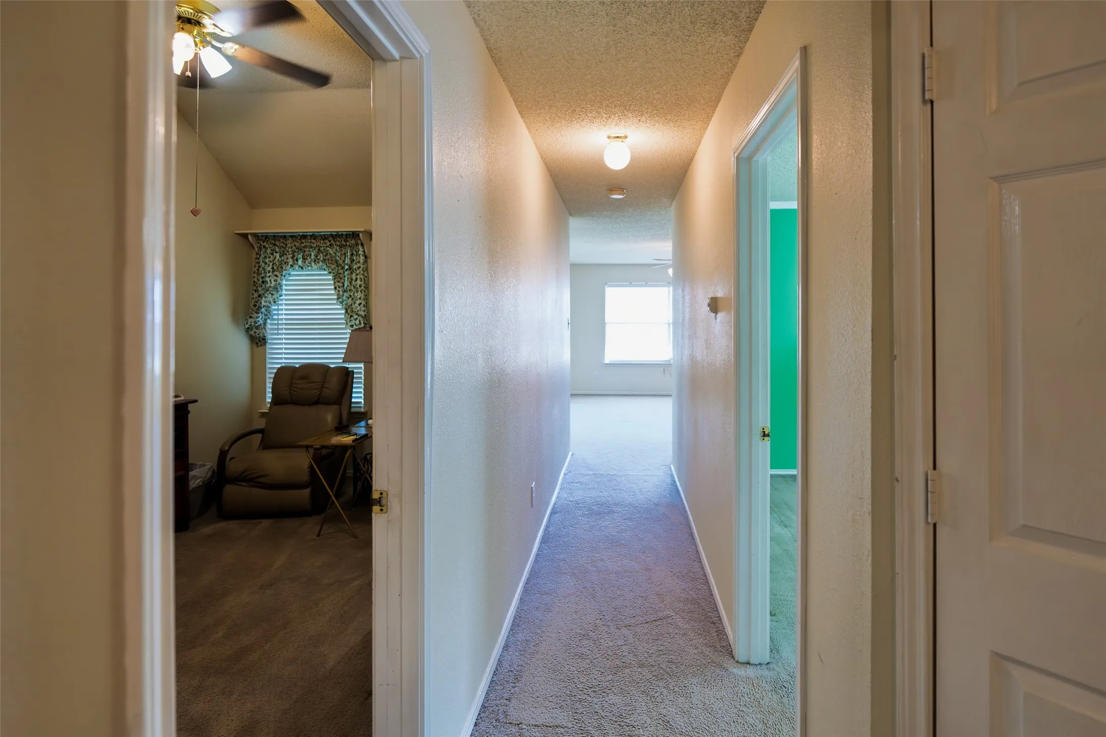 Upstairs hallway leading to the private primary suite, oversized game room and three secondary bedrooms