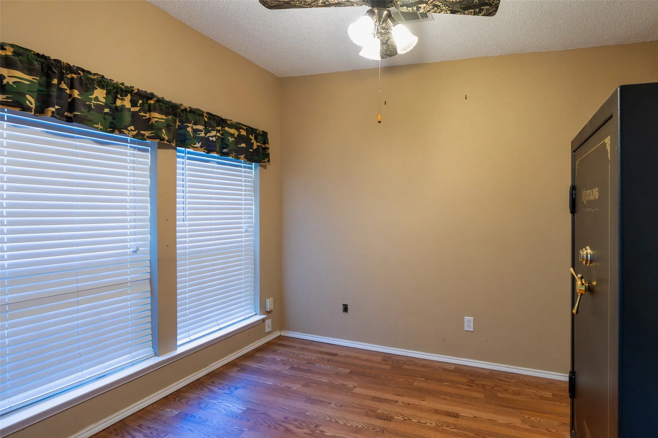 Versatile first-floor bedroom ideal for guests, a home office, or hobby space