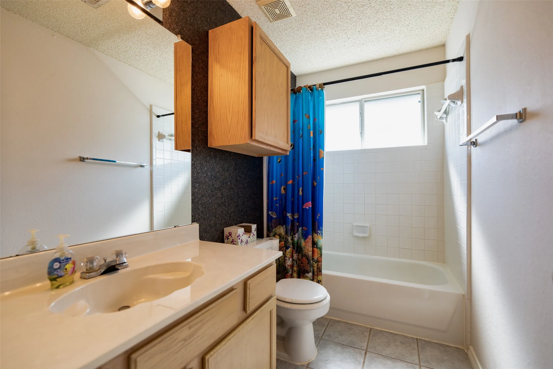Upstairs full bathroom with tub/shower combination serving the secondary bedrooms and game room