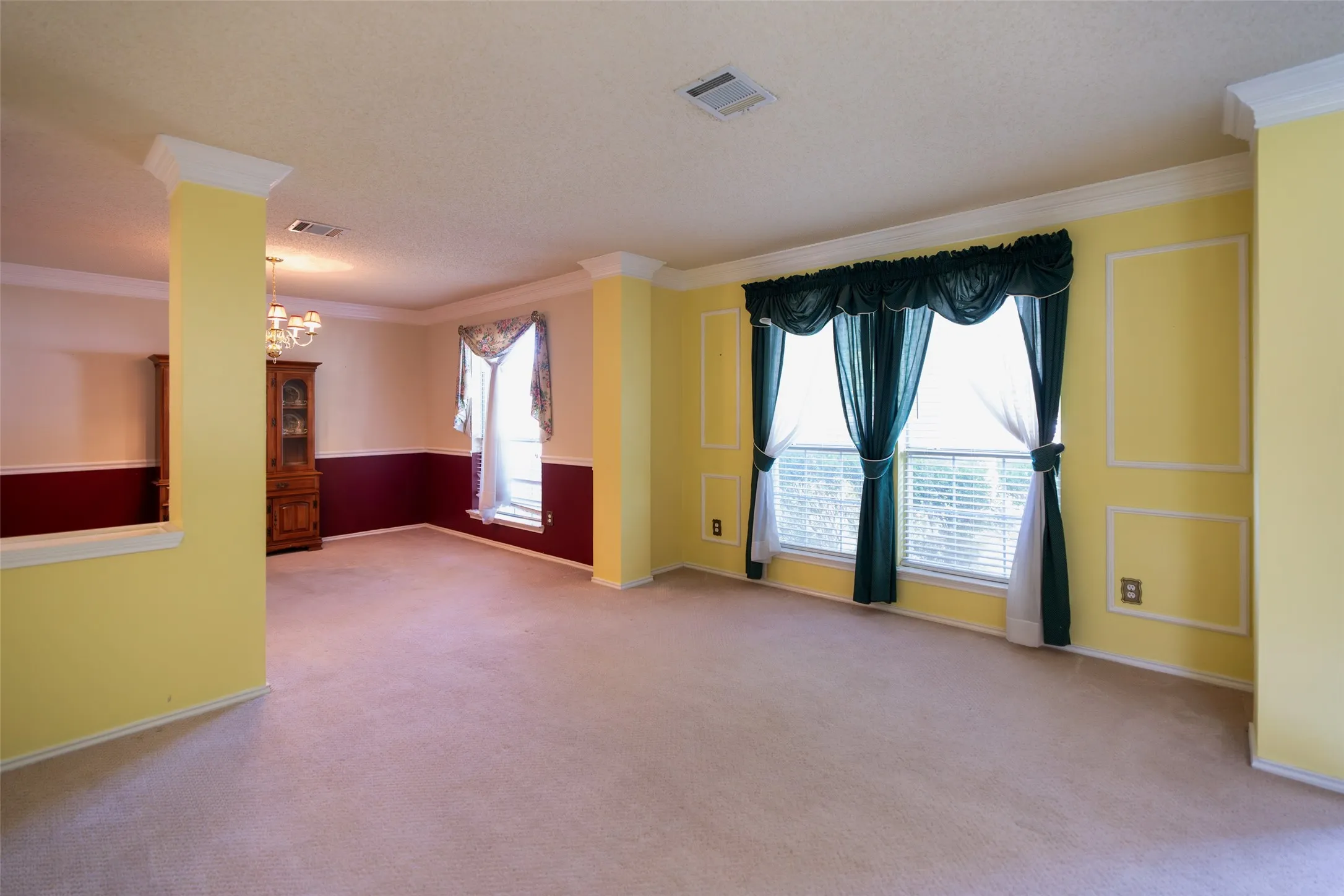 Light-filled formal living room with adjoining dining area creates a welcoming first impression