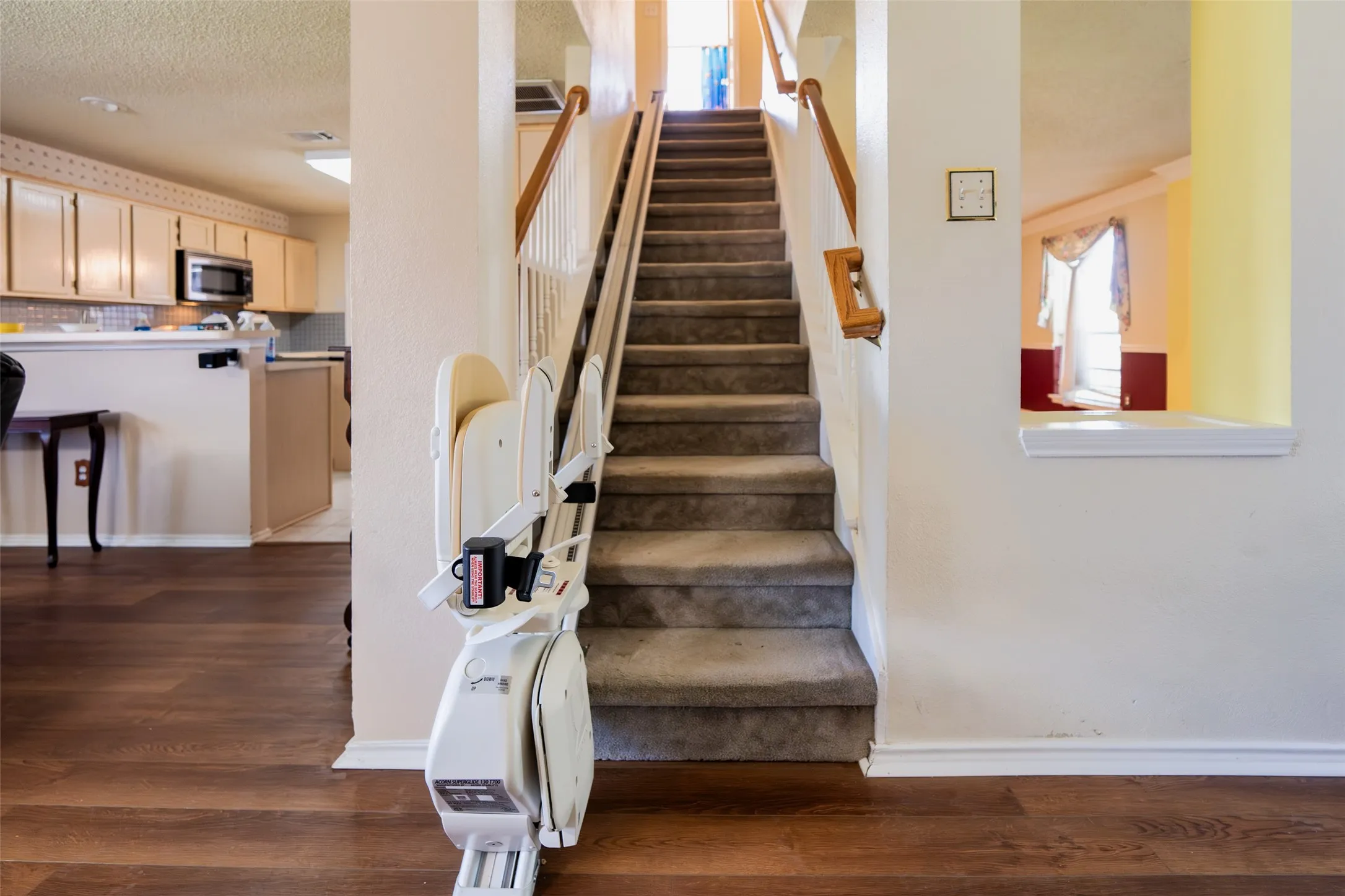 Central staircase connecting both levels of the home. Stair lift will convey.