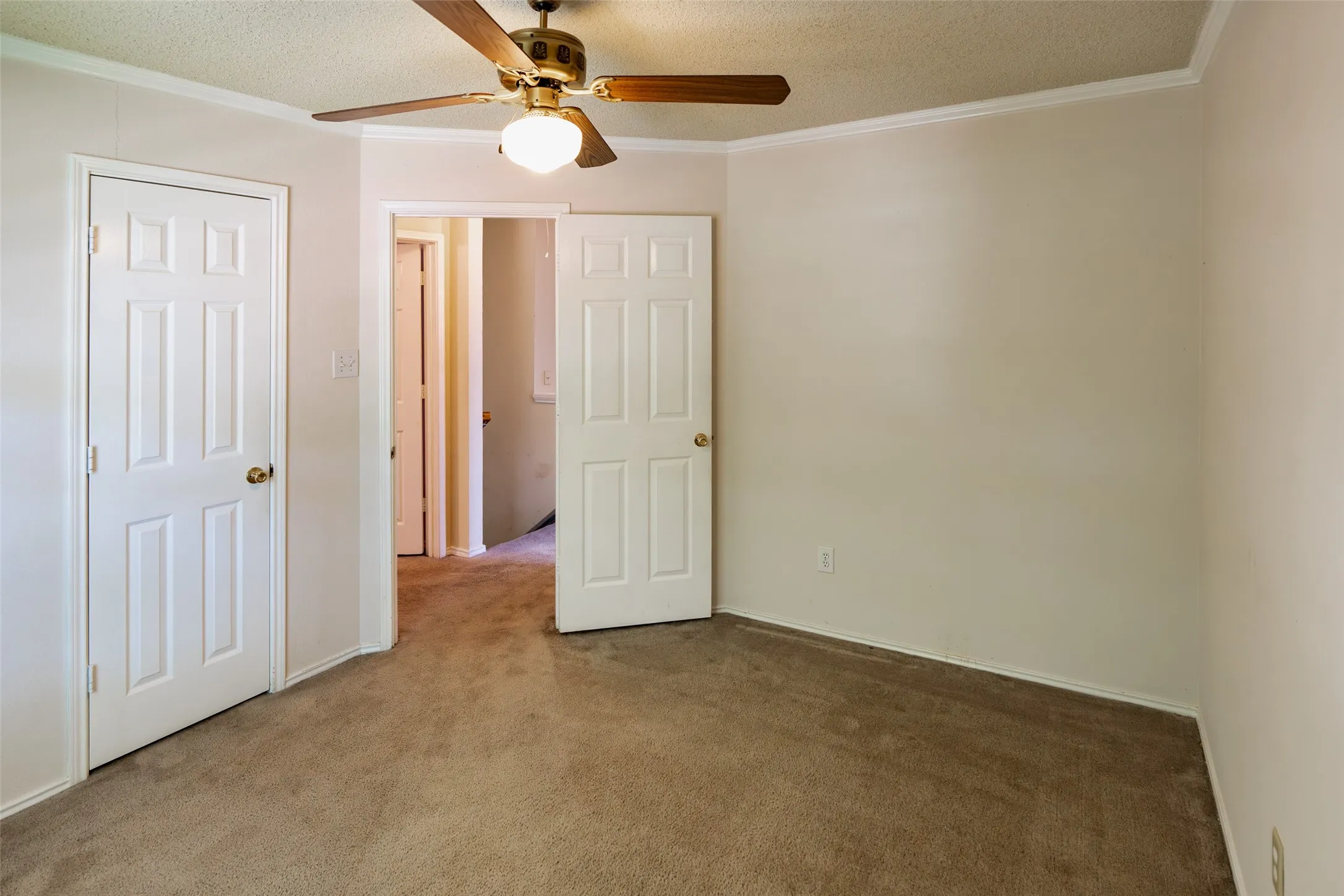 Secondary bedroom featuring a walk-in closet and easy access to the upstairs hall bath