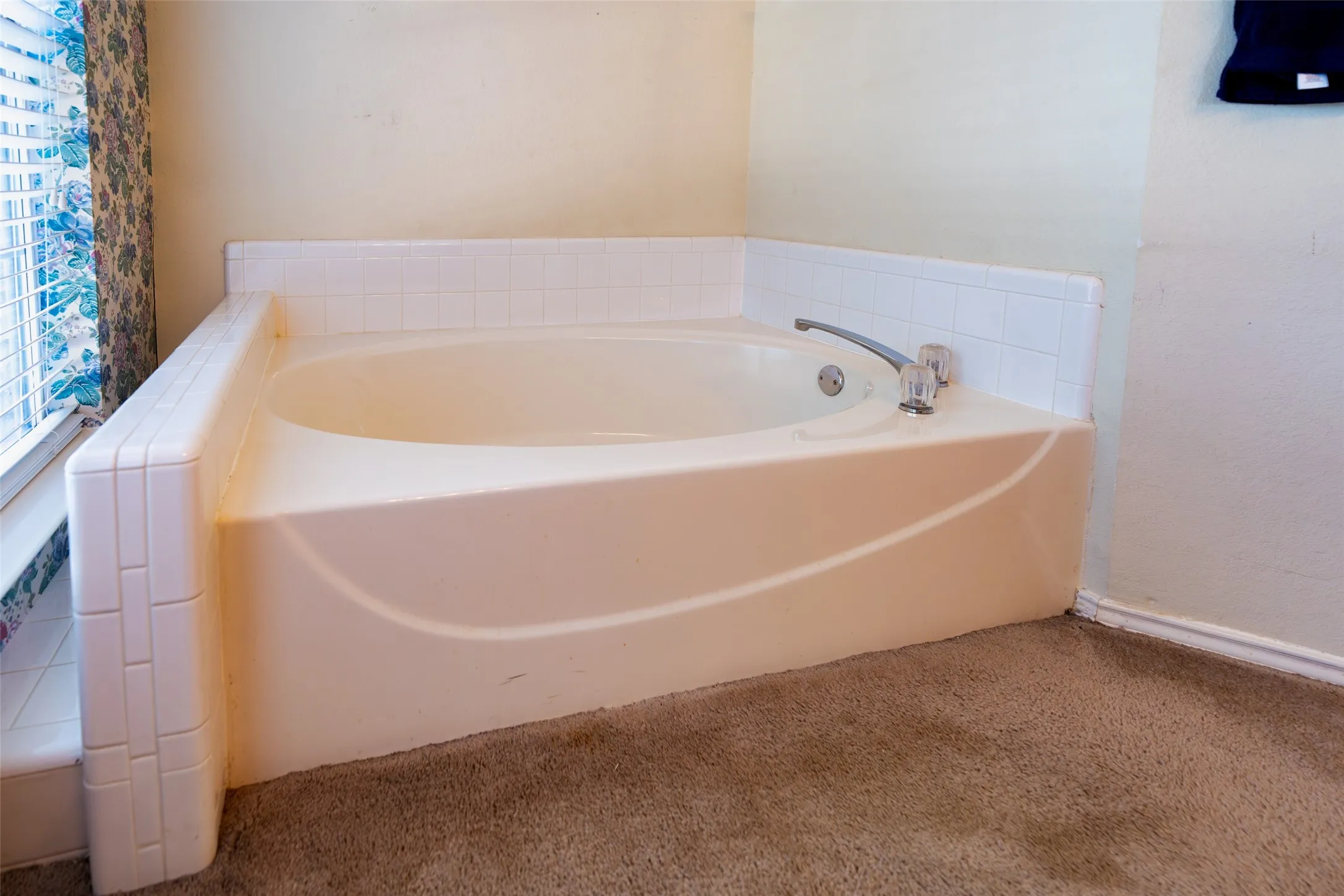 Oversized corner soaking tub completes the spacious primary bath