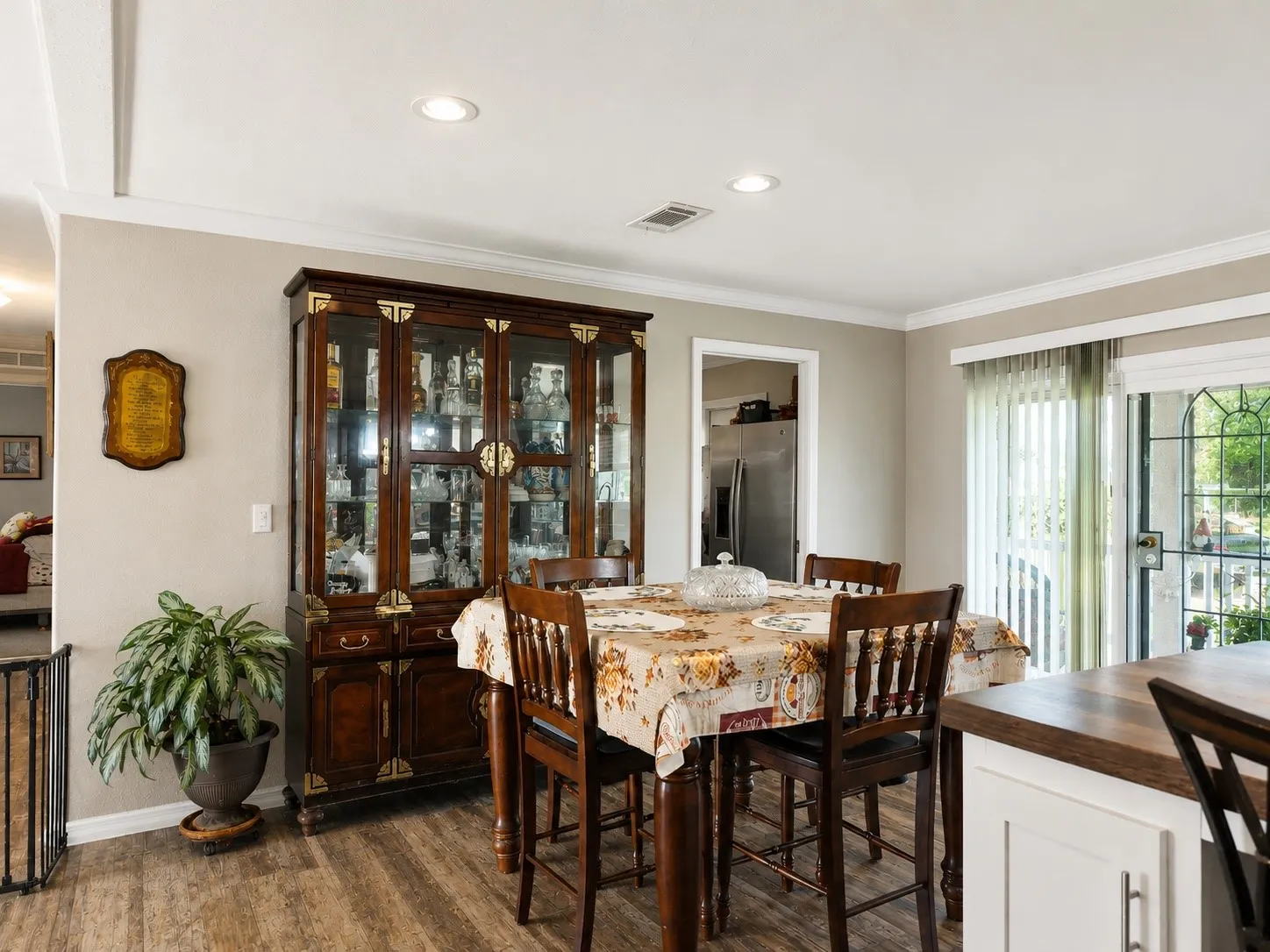 Dining area featuring wood-finish flooring and recessed lighting