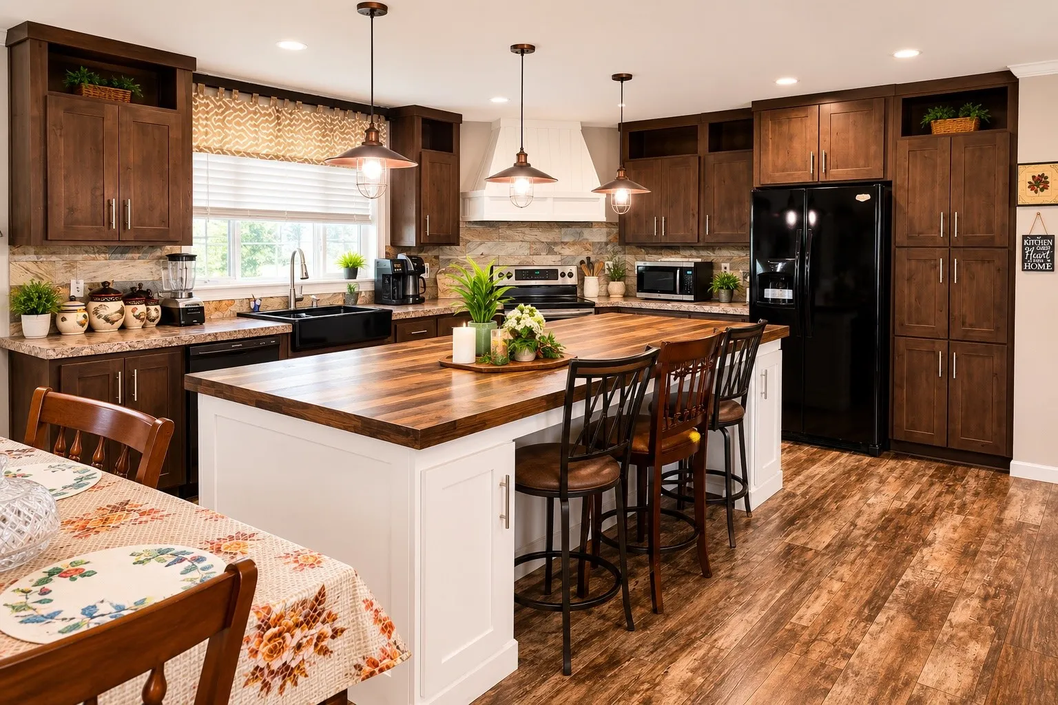 Open-concept kitchen featuring a large central island with seating, rich wood-finish flooring, dark wood cabinetry, and stone-look countertops
