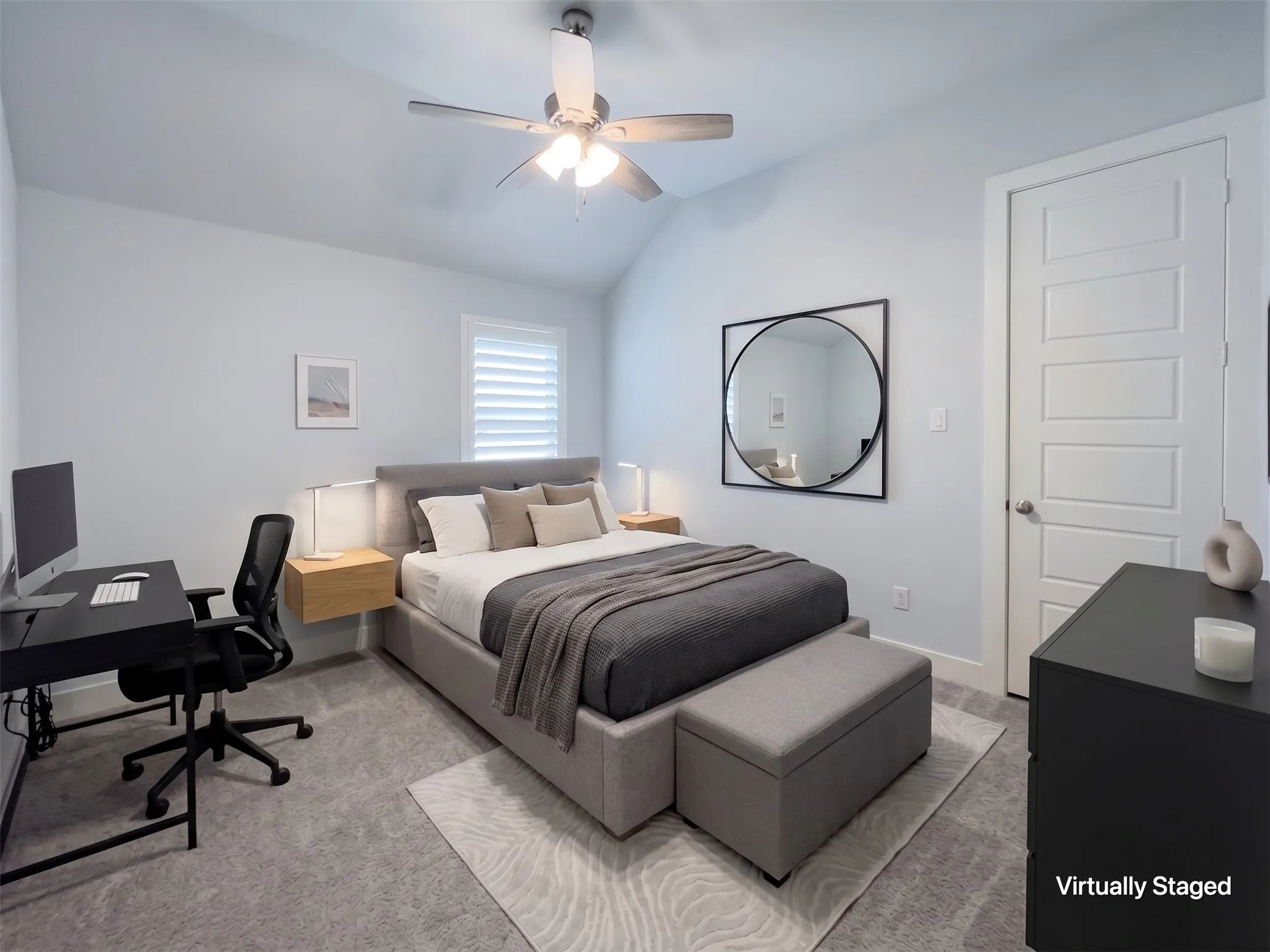 Carpeted bedroom featuring a ceiling fan, window with white louvered shutters, and a five-panel interior door