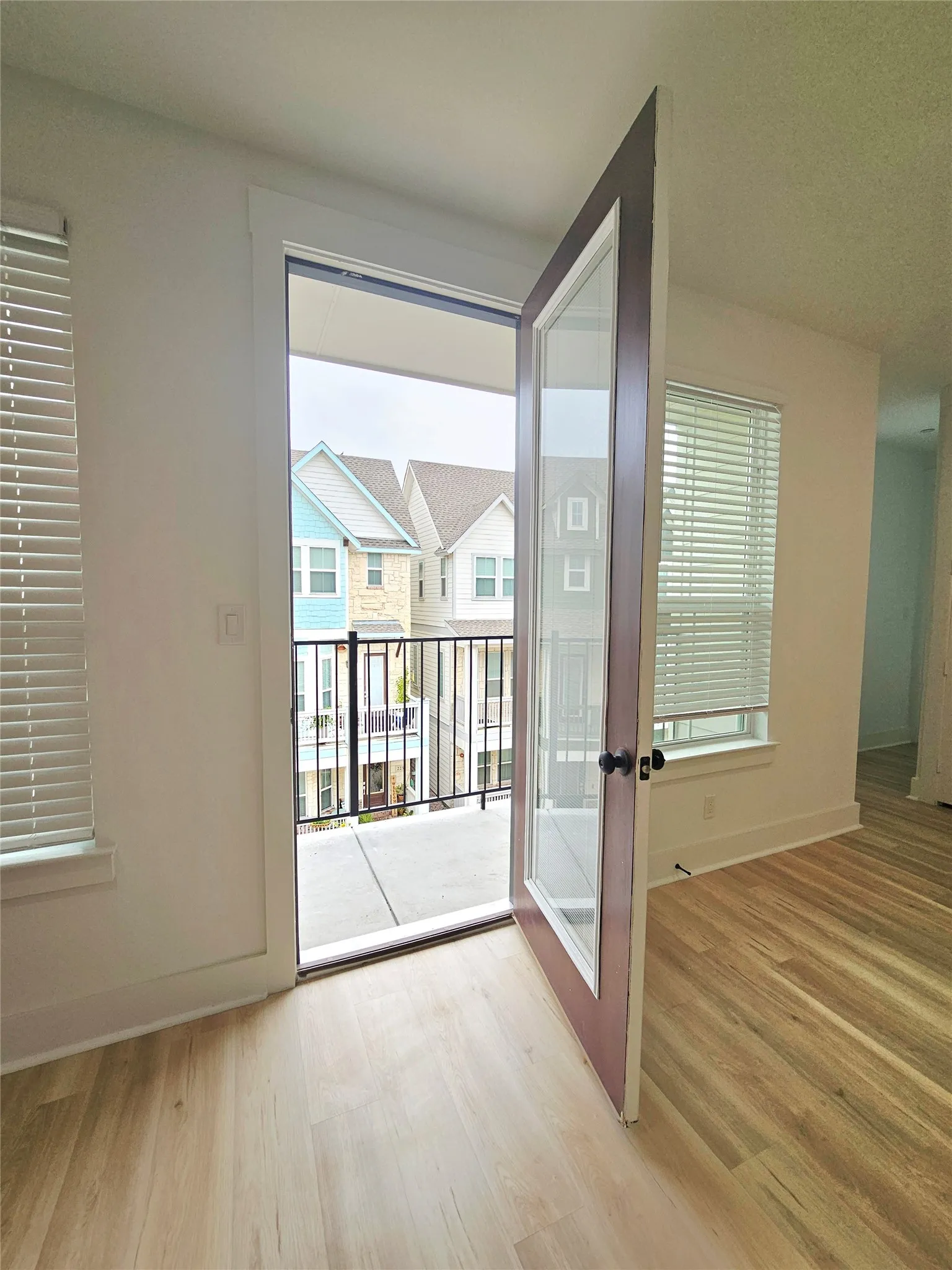 Entryway with wood finished floors, baseboards, and french doors