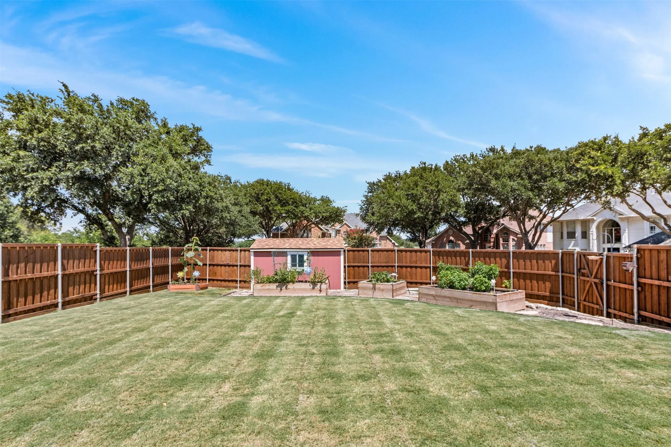 Large Corner Lot Backyard with Storage Building