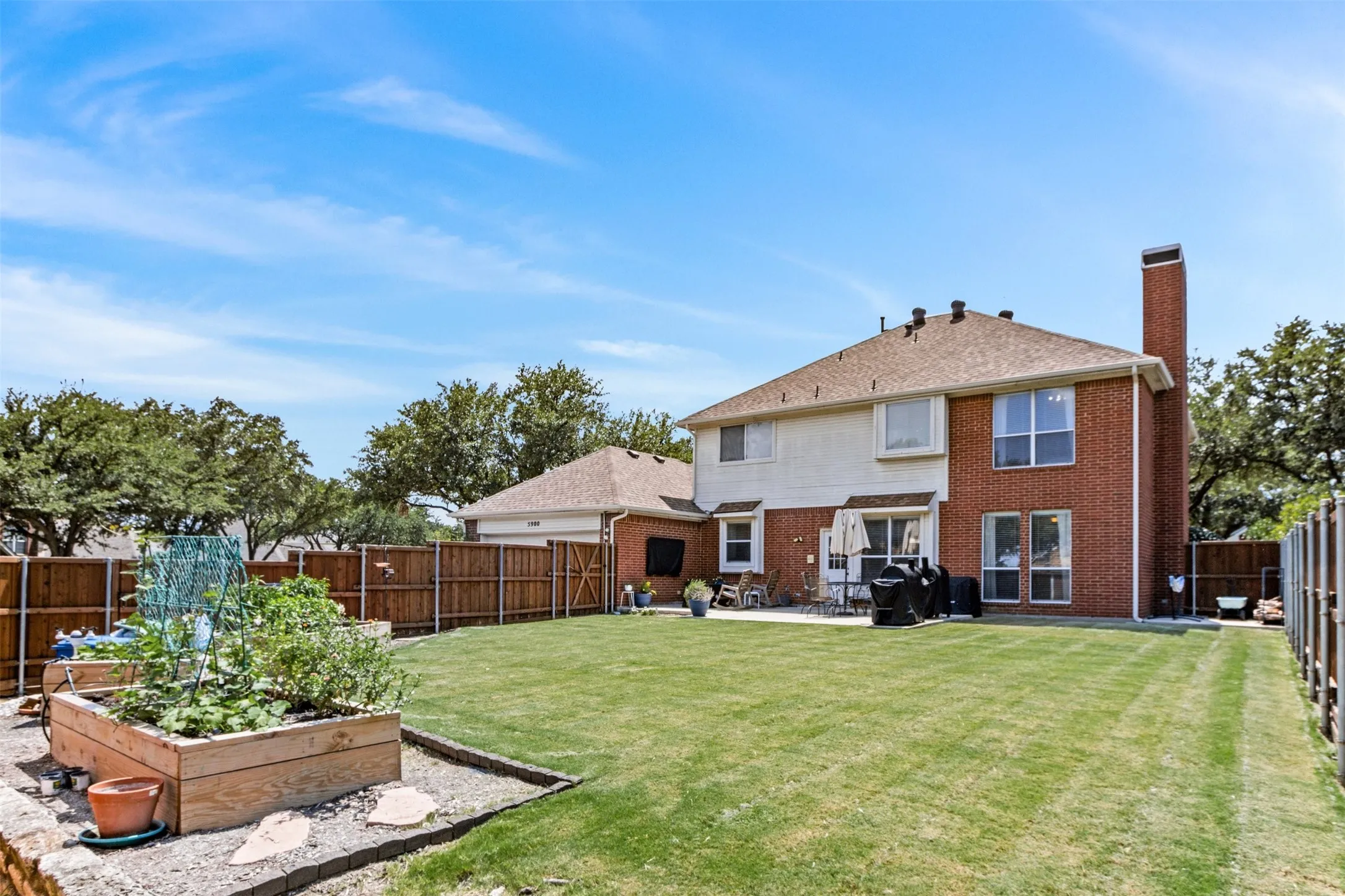 Large Corner Lot Backyard with above ground Garden