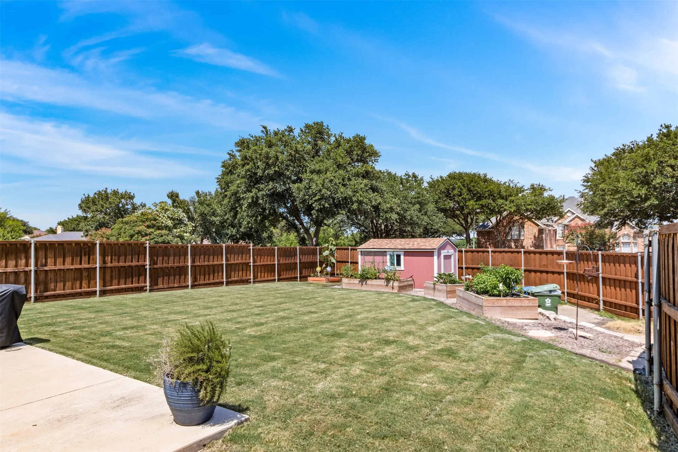 Large Corner Lot Backyard with Storage Building