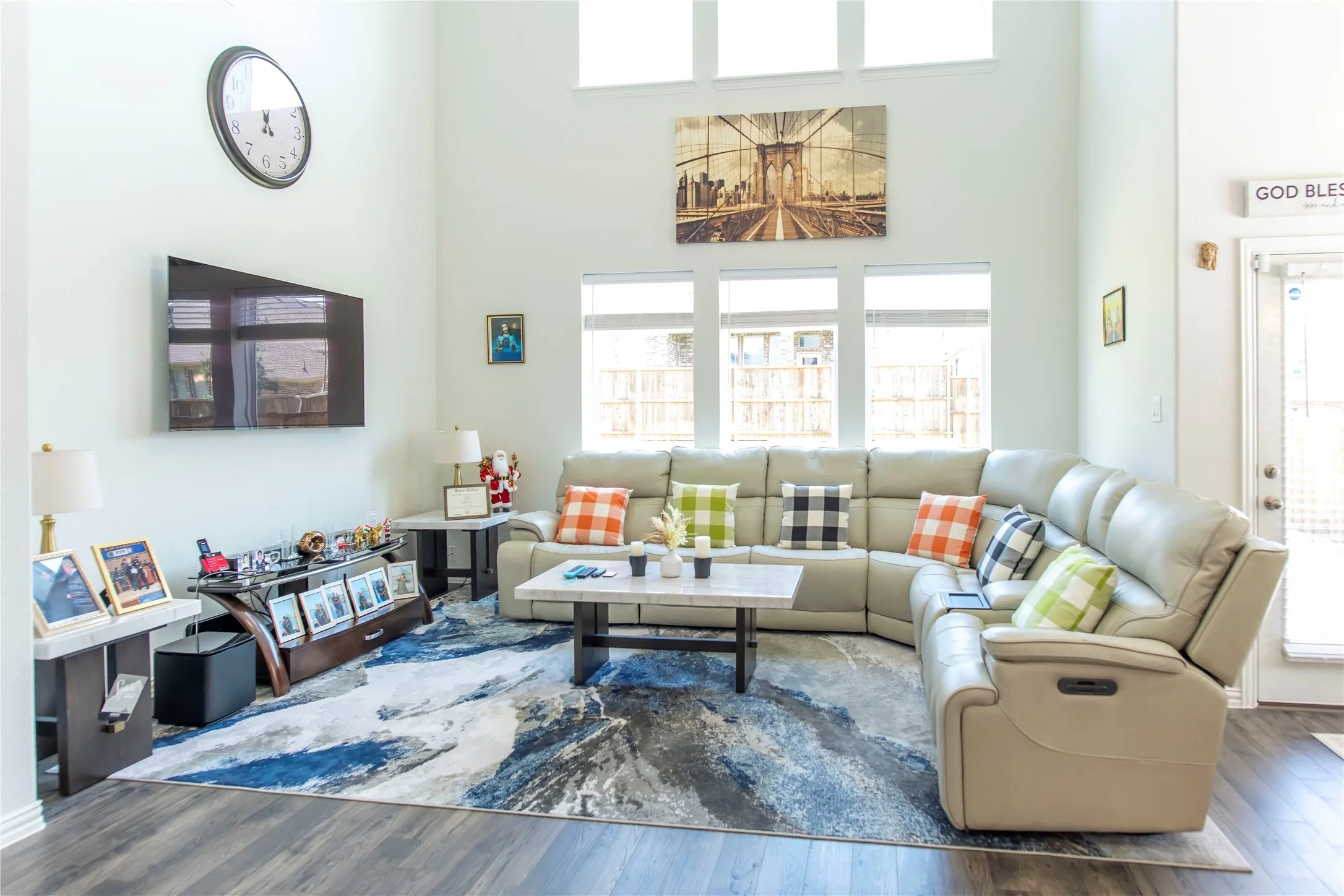 Two-story interior space featuring high ceilings and wood-finish flooring
