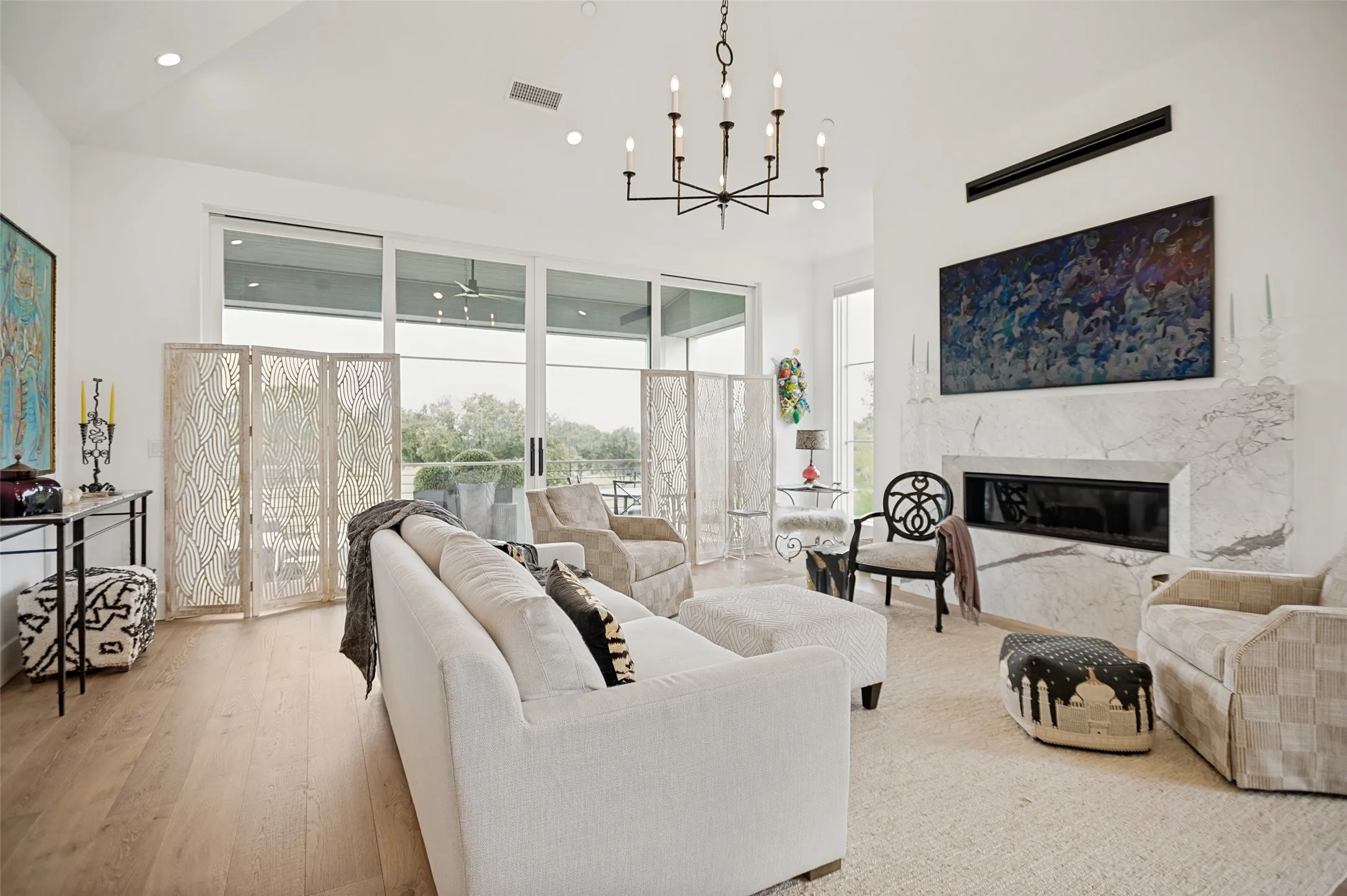 The spectacular living room features soaring vaulted ceilings