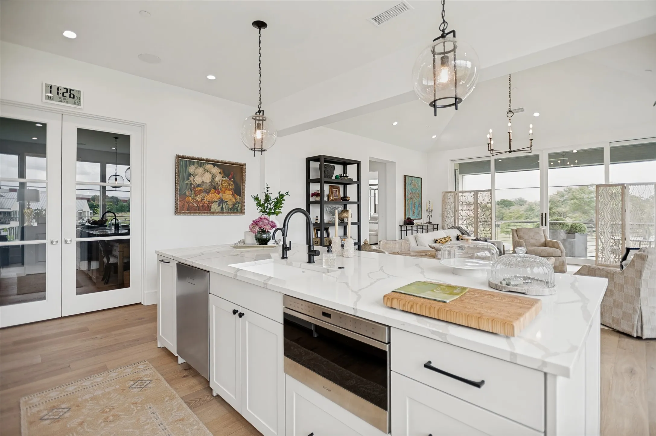 The open concept design enhances the home's sophisticated style