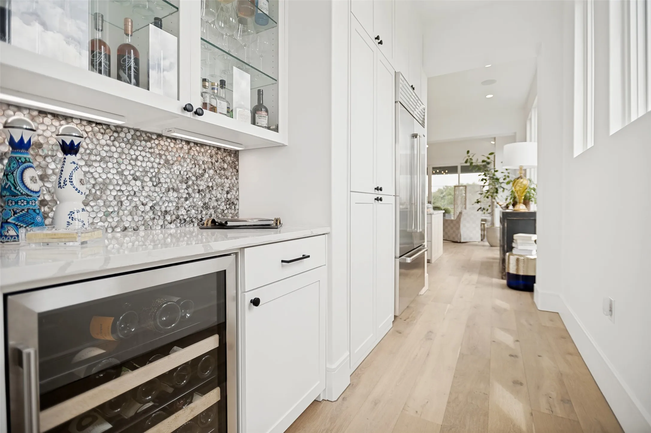 Butlers pantry and bar flow effortless to the formal dining area