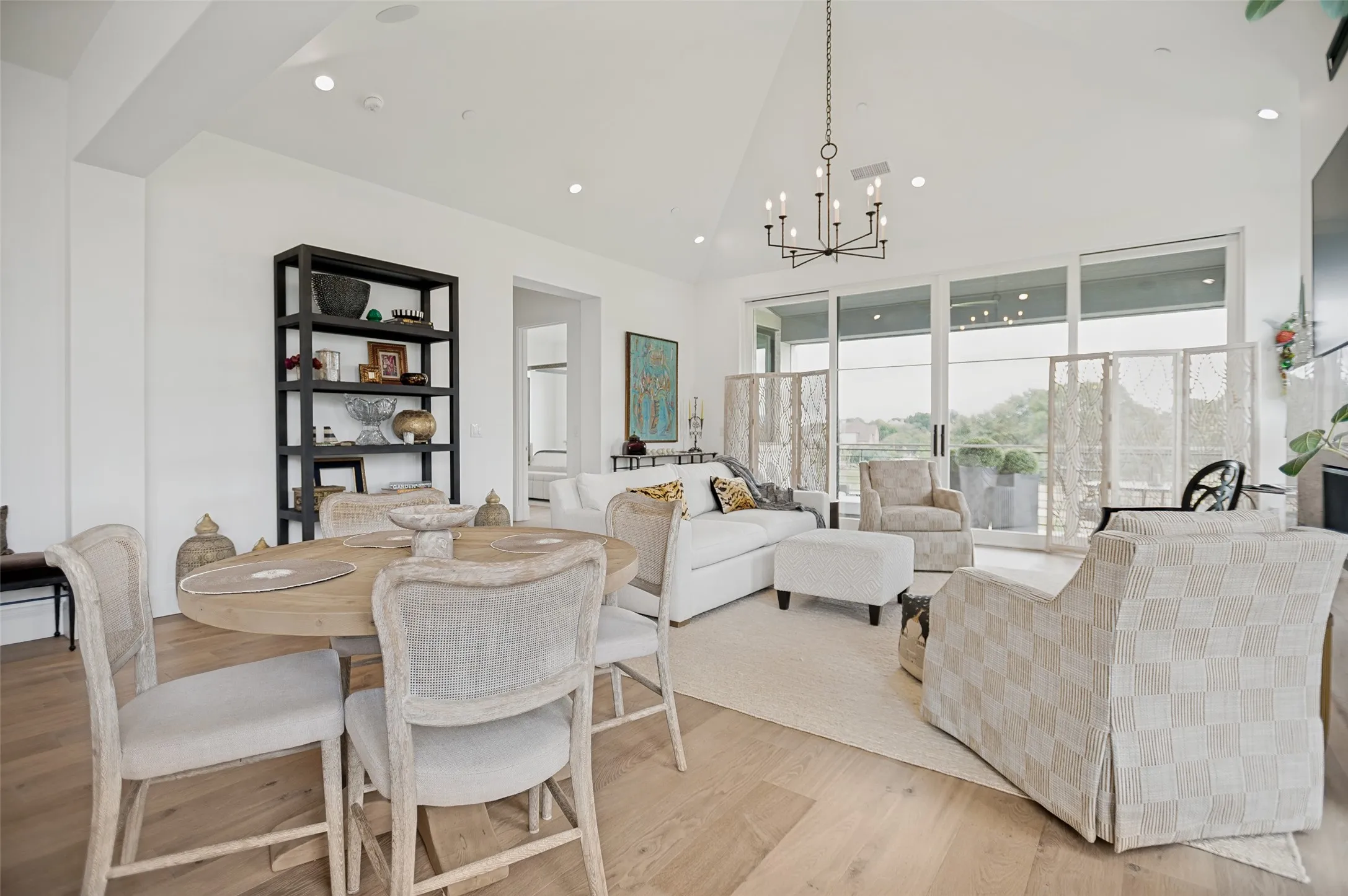 Dramatic walls of windows on all sides fill the space with natural light