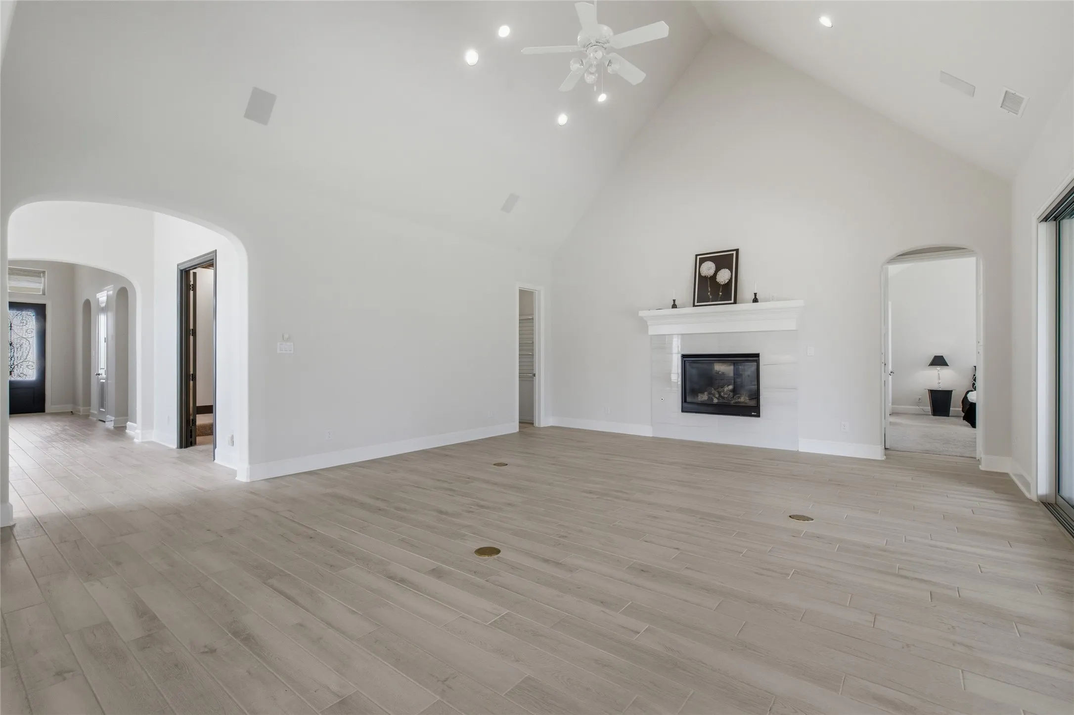 Great Room with Volume Ceilings, Custom Fire Place and Unobstructed View of Generously Size Backyard.