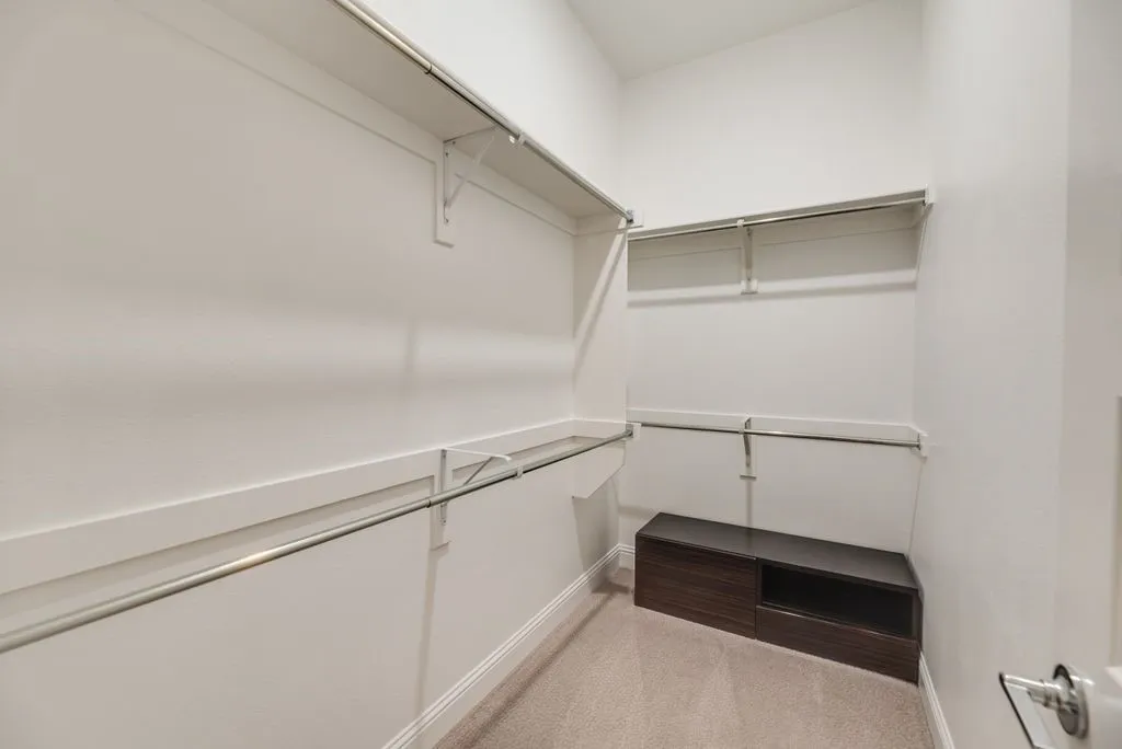 One of two primary closets.