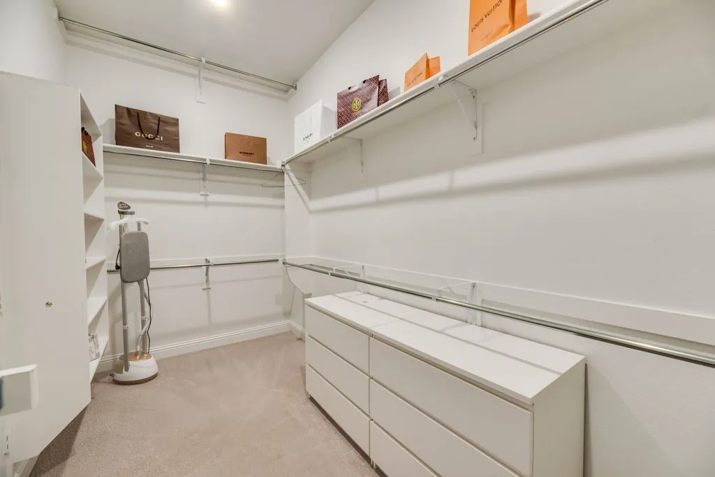 One of two primary closets.