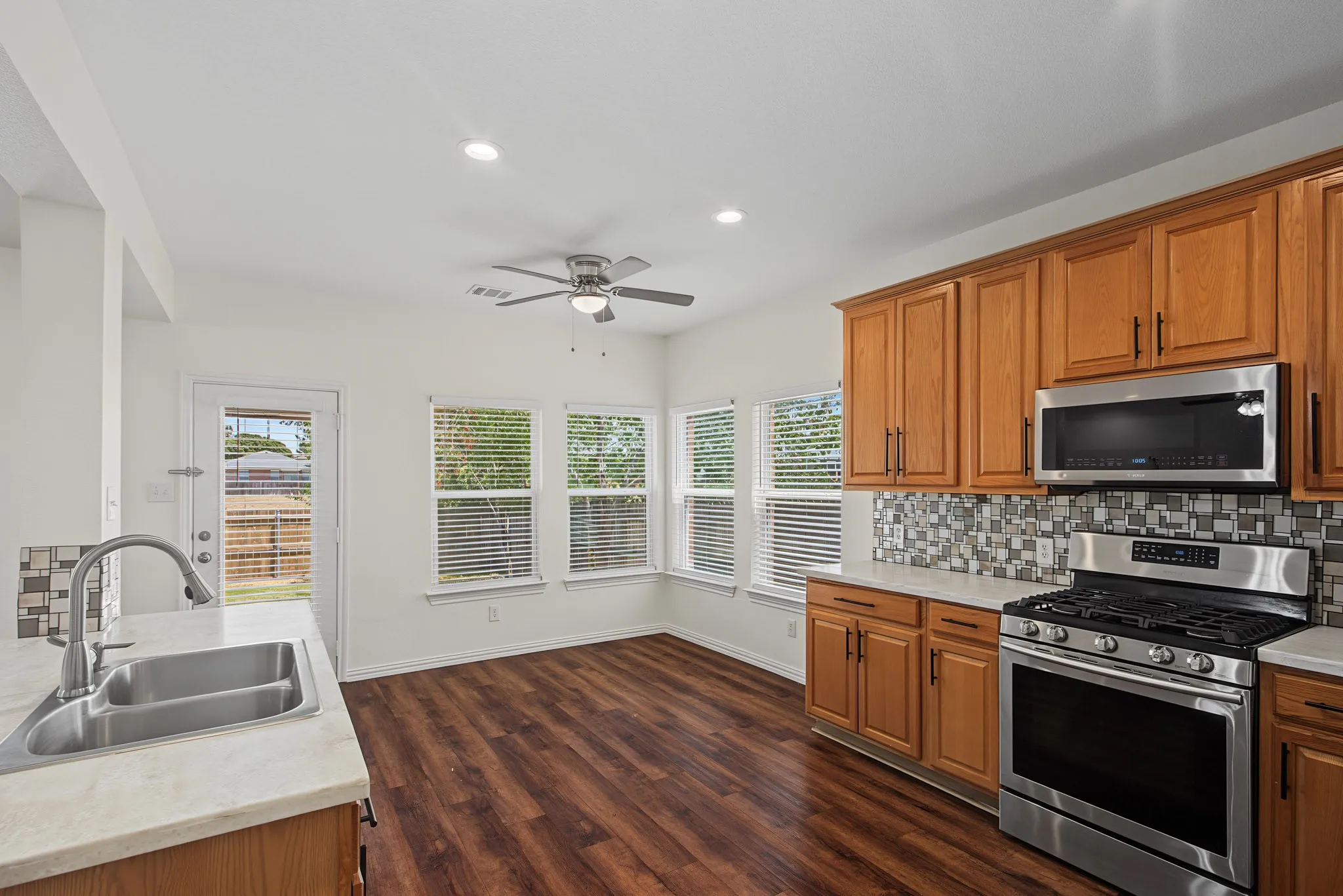 Kitchen featuring wood-finish flooring, recessed lighting, and a ceiling fan