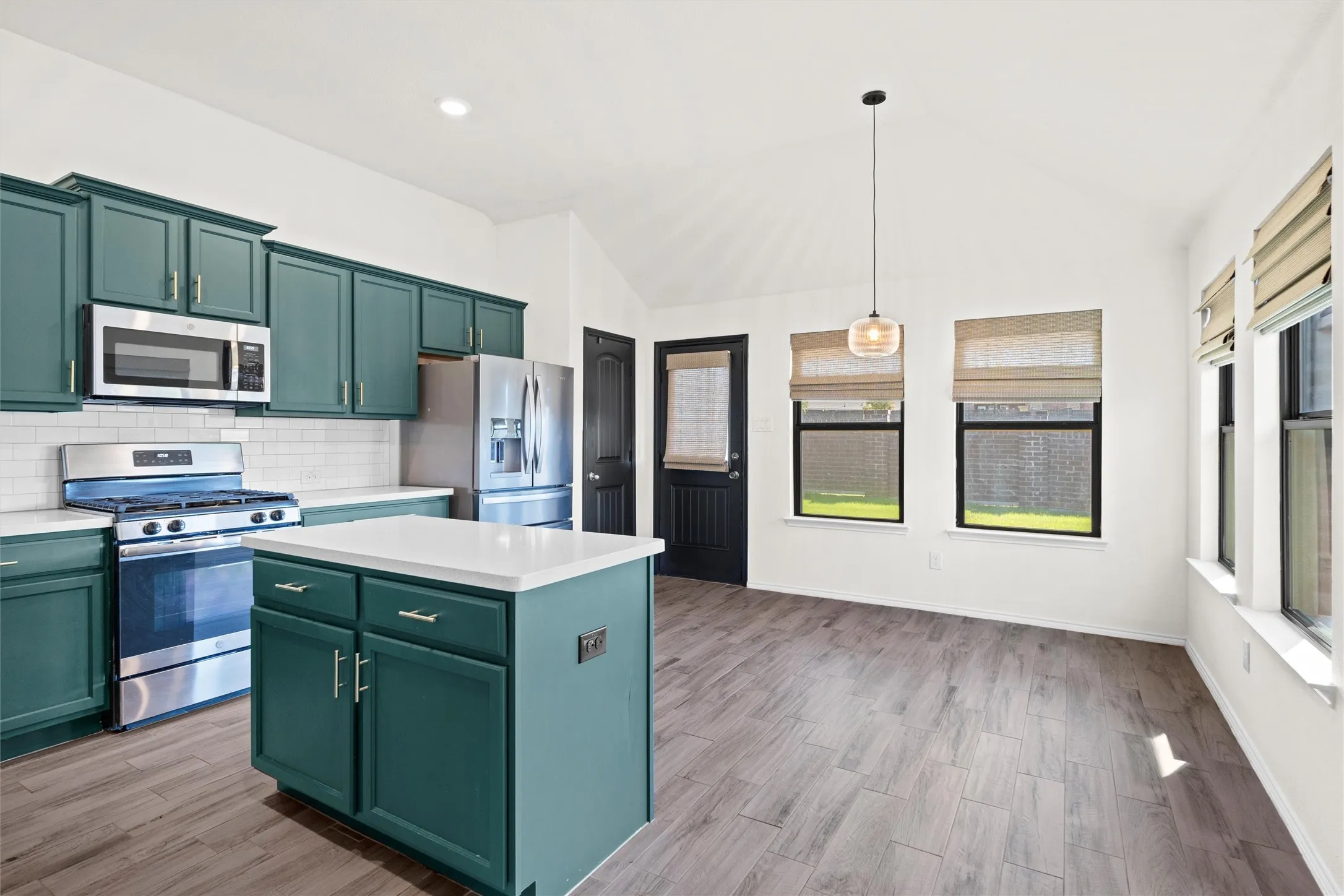 Stop scrolling! This kitchen is a total showstopper. Featuring rich emerald green cabinetry, modern gold hardware, premium stainless steel appliances (including a gas range!), a classic subway tile backsplash, and a large center island with crisp white quartz countertops. The adjacent dining space walks straight out to the backyard!
Tags: #KitchenGoals #GreenCabinets #QuartzCountertops #GasCooking #DreamKitchen