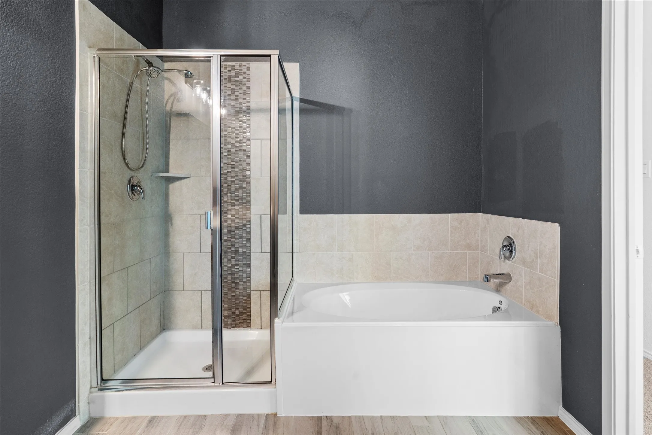 The best of both worlds! Whether you need a quick morning rinse or a long weekend soak, this bathroom has you covered. Enjoy a fully tiled, glass-enclosed walk-in shower with custom mosaic tile accents alongside a deep, pristine garden soaking tub.
Tags: #SoakingTub #WalkInShower #BathroomInspo #SpaVibes #HomeForRent
