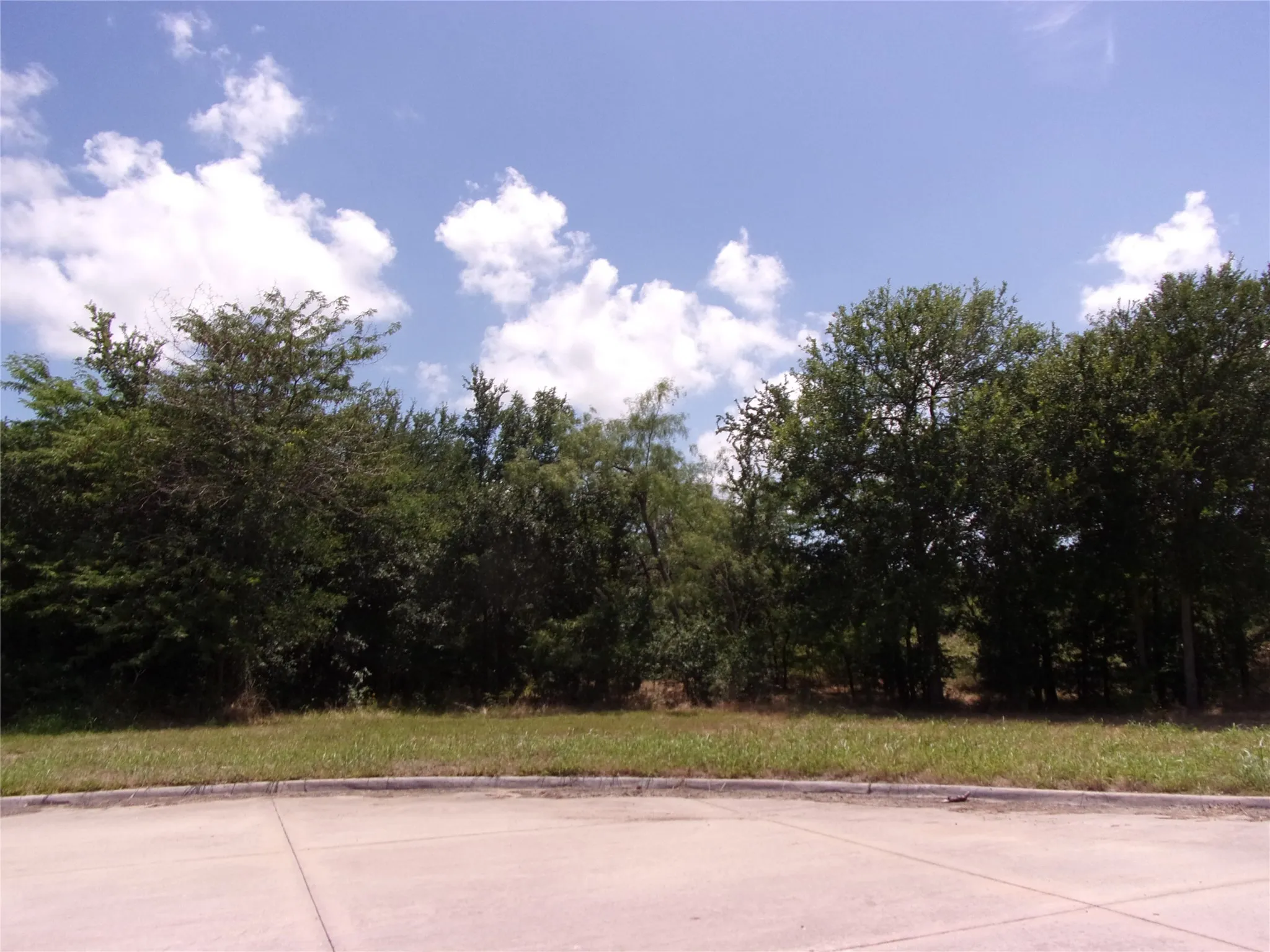 Great shot of the front left corner looking in towards the lot. Did we mention, grill, party and play?