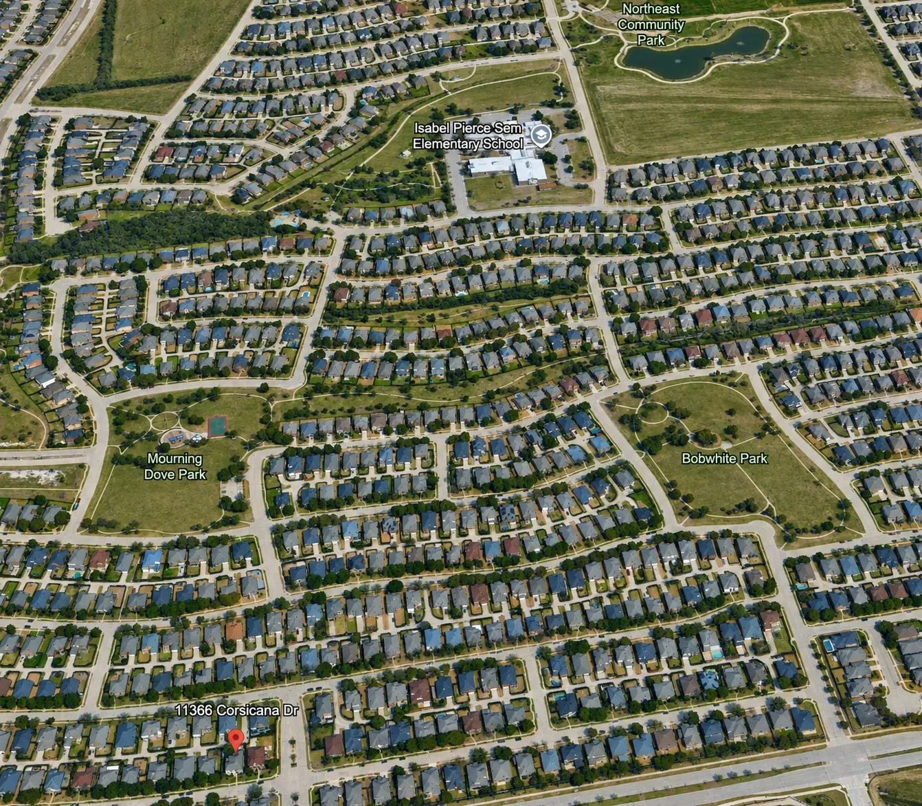 Aerial perspective showcasing a residential area with numerous single-family homes