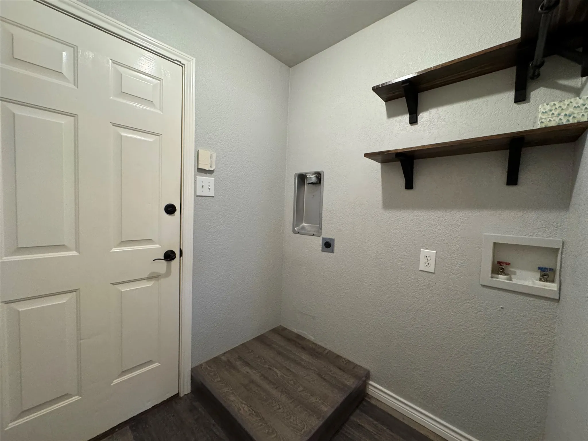 Laundry room can accommodate stackable or side-by-side units
