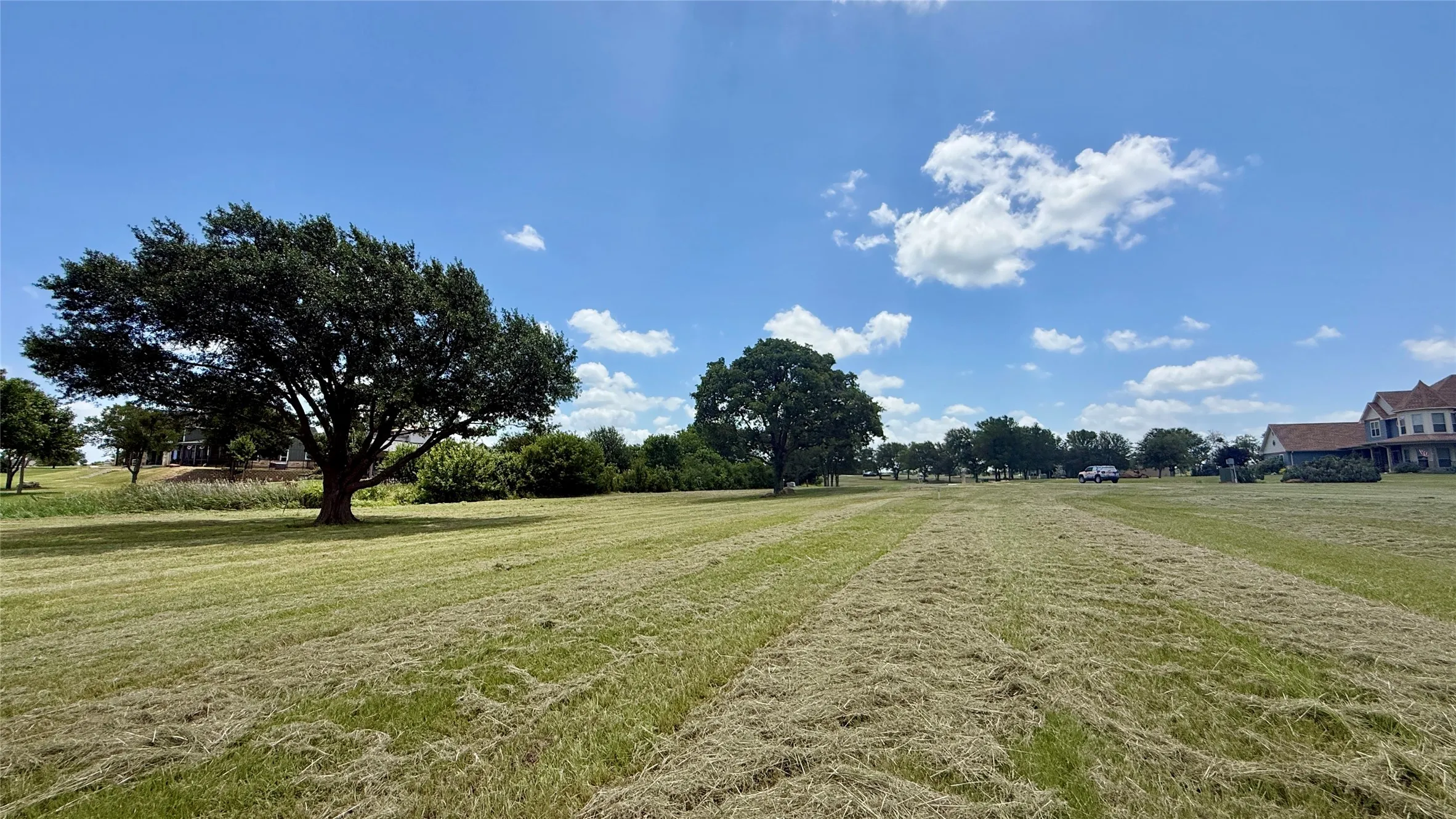 Beautiful waterfront homesite combines shade trees, open water views, and privacy.