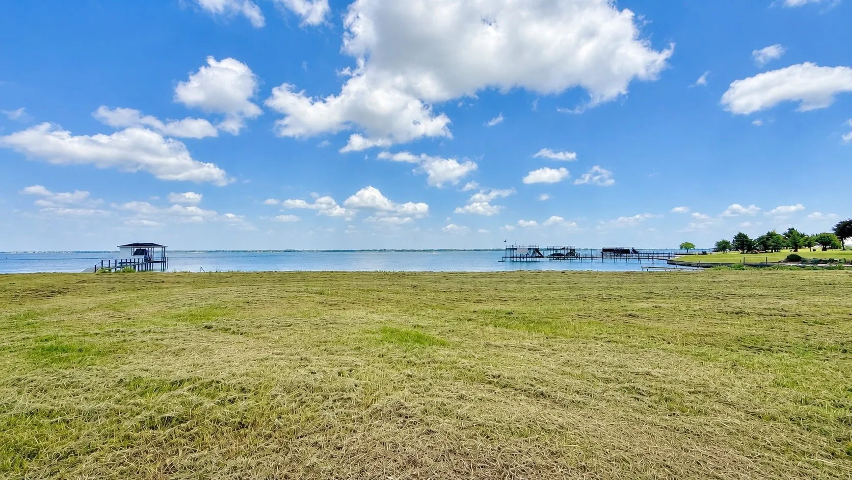 Expansive waterfront homesite offers panoramic lake views and endless building possibilities.