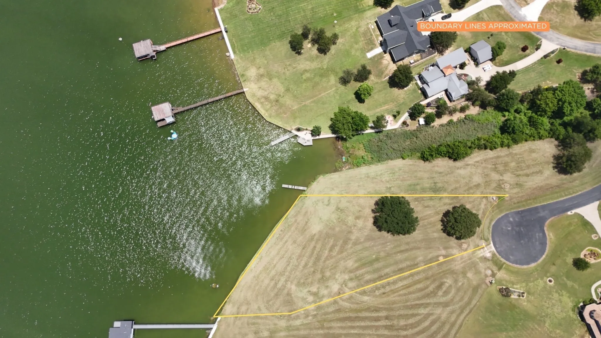 Aerial perspective showcases the expansive homesite and scenic Richland Chambers shoreline.