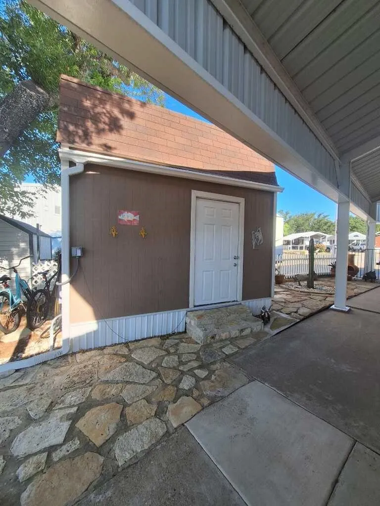 Large shed with full size W/D. Access right from covered side porch.