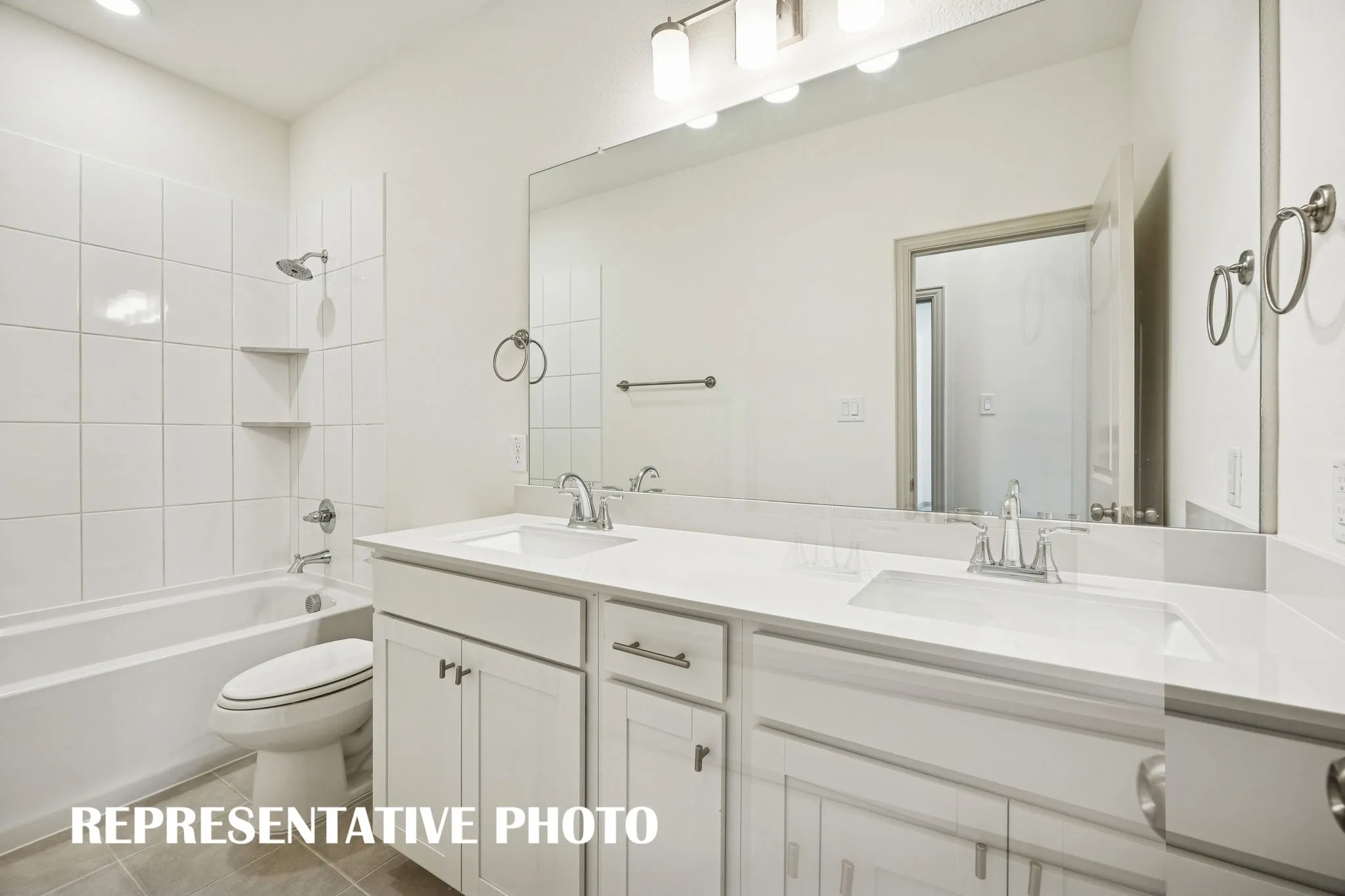 Friends and family will enjoy their own vanity space in this thoughtfully designed guest bath.  REPRESENTATIVE PHOTO
