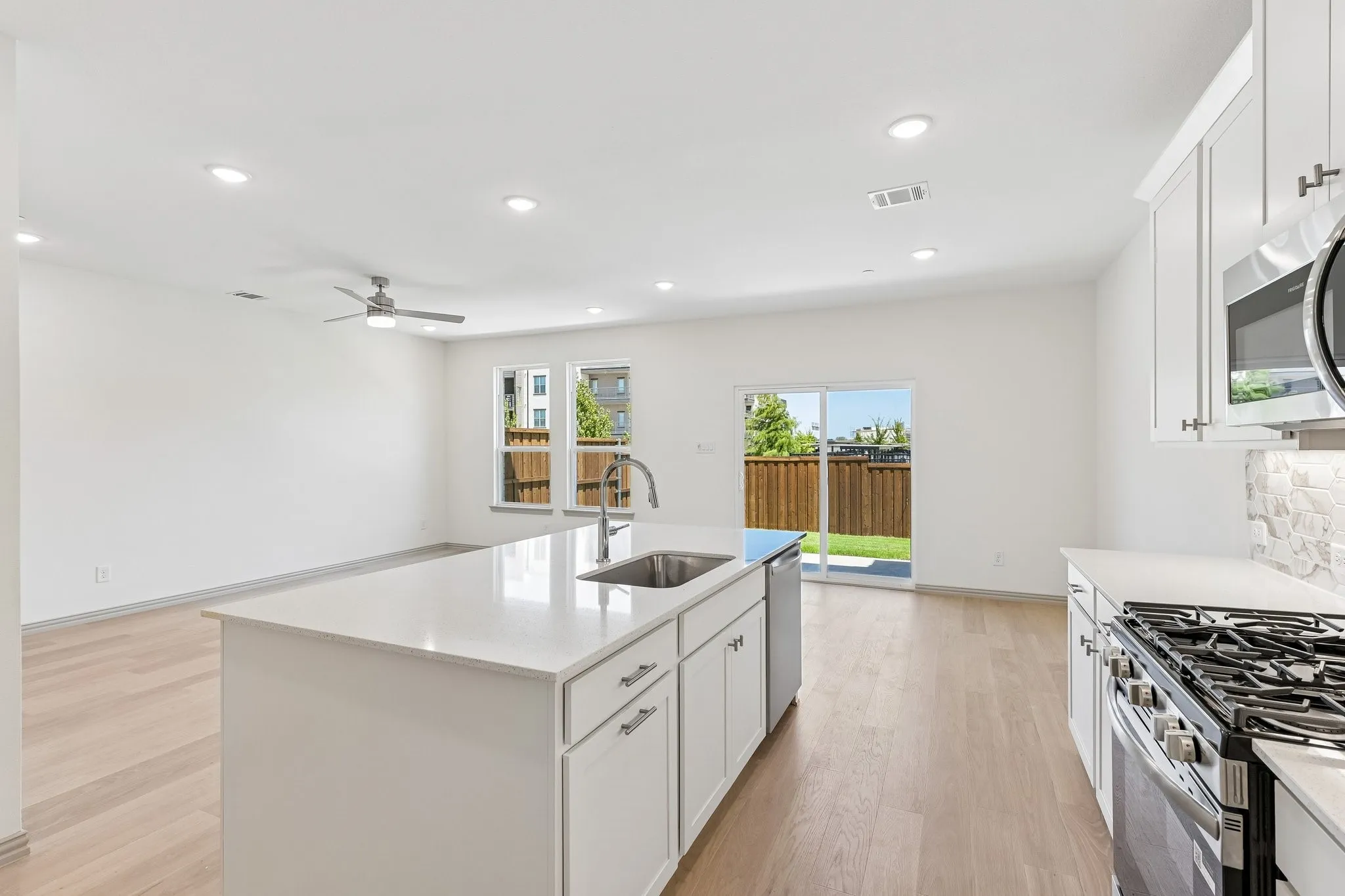 With the kitchen open to the dining and family rooms, the chef will never be left out of the party in this wonderful home!