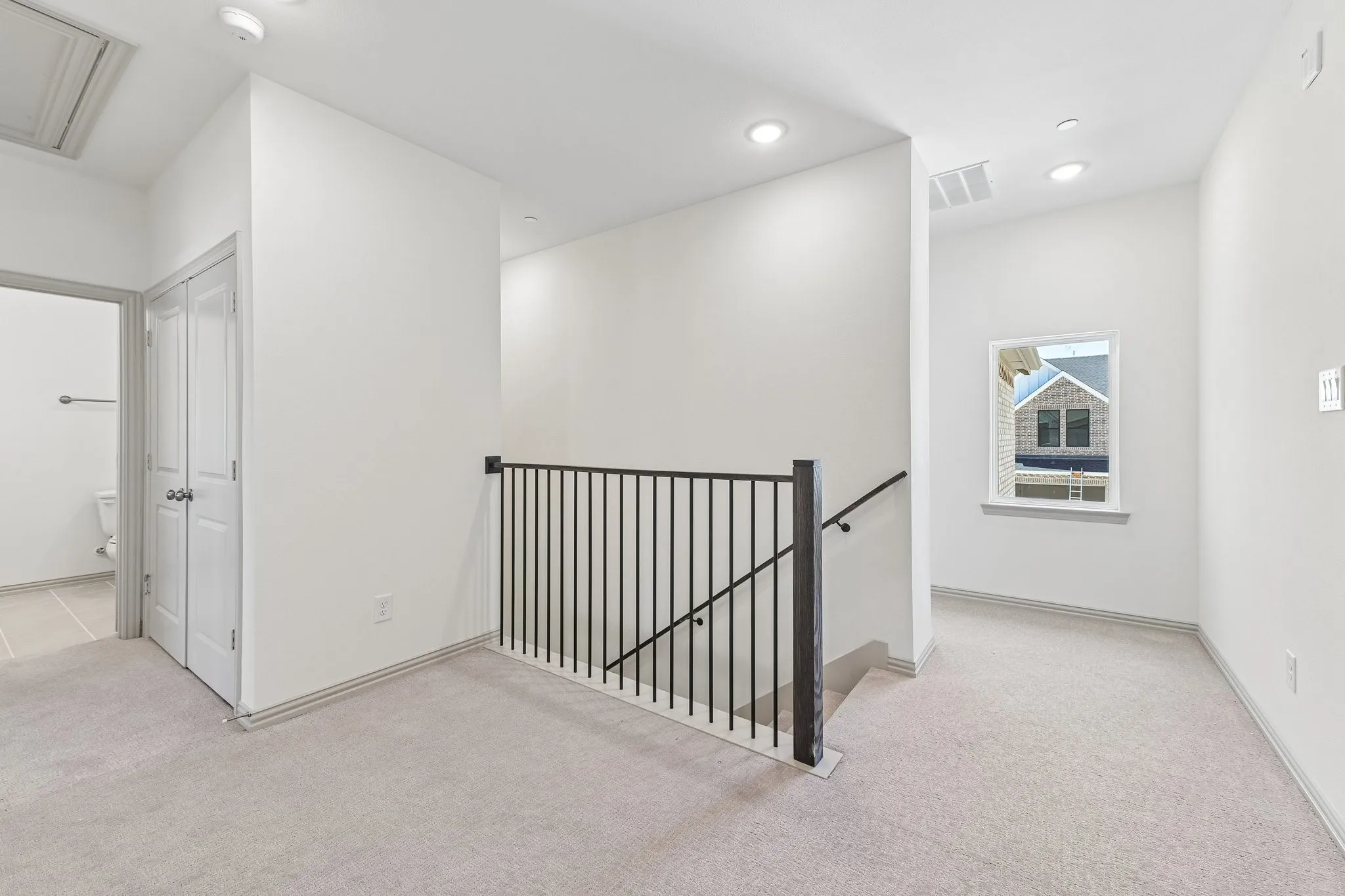 The loft area in our Channing plan features open railings that create a lovely space perfect for a reading nook or pocket office!