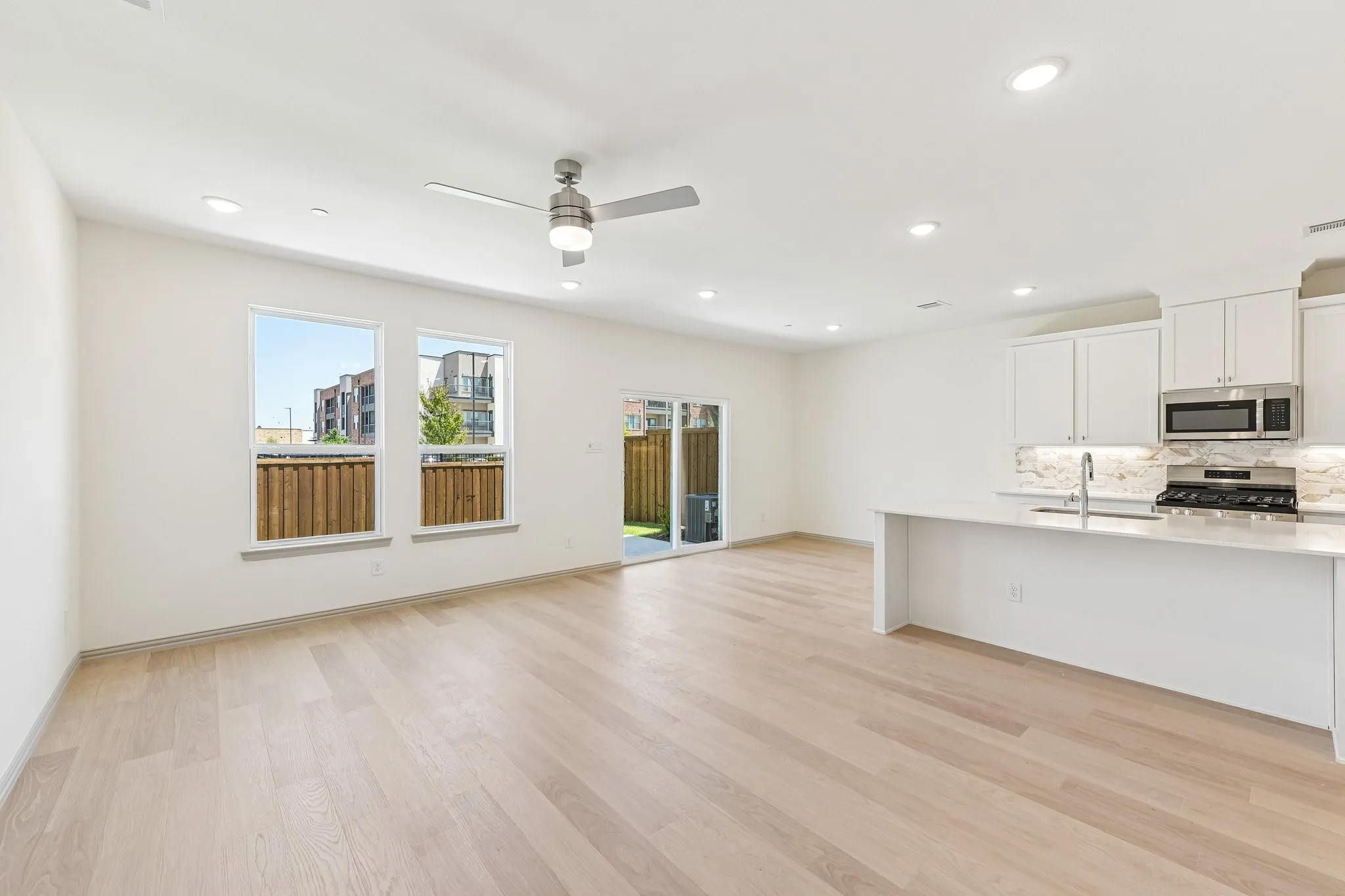 Light, bright and airy, this open concept kitchen-dining-living area is everything you have been searching for.