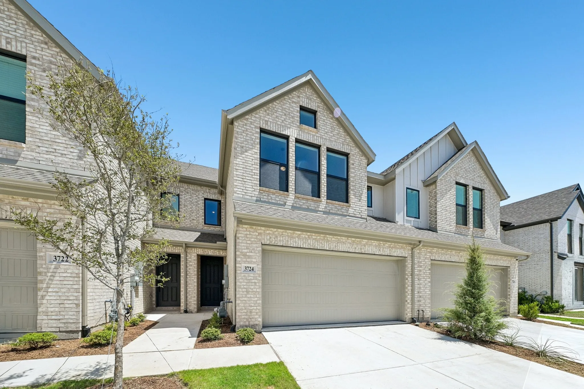 With lovely light colored brick, complementary trim and a striking front gable, this dream home offers outstanding curb appeal!